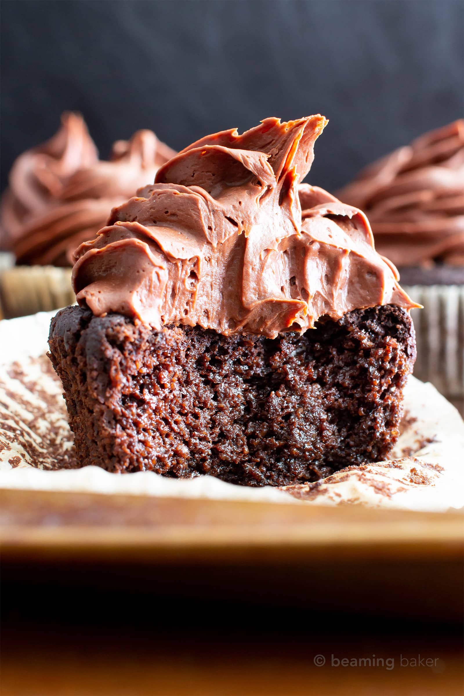 Paleo Chocolate Cupcakes Recipe (Almond Flour, GF): rich ‘n moist vegan gluten free cupcakes topped with creamy chocolate frosting! The best paleo cupcakes—made with gluten free, dairy free, healthy ingredients! #Vegan #Paleo #Cupcakes #GlutenFree #DairyFree | Recipe at BeamingBaker.com