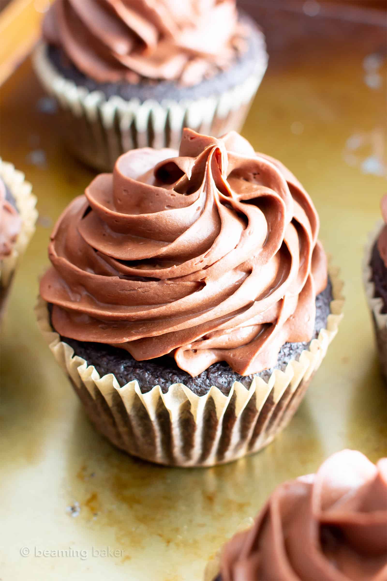 Paleo Chocolate Cupcakes Recipe (Almond Flour, GF): rich ‘n moist vegan gluten free cupcakes topped with creamy chocolate frosting! The best paleo cupcakes—made with gluten free, dairy free, healthy ingredients! #Vegan #Paleo #Cupcakes #GlutenFree #DairyFree | Recipe at BeamingBaker.com