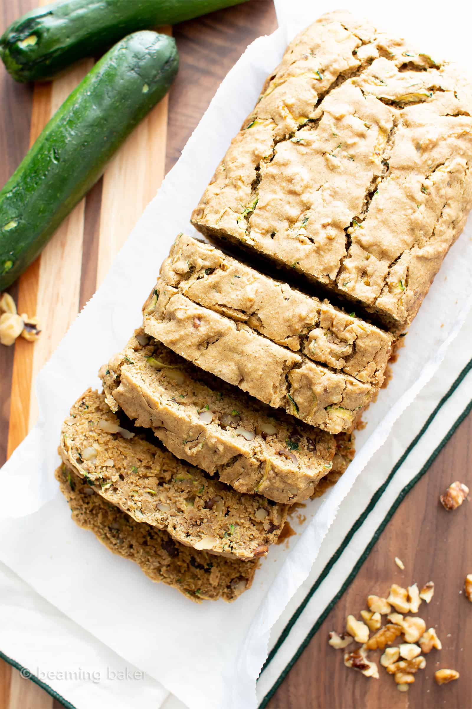 Overhead photo of vegan gluten free zucchini bread on a wooden cutting board