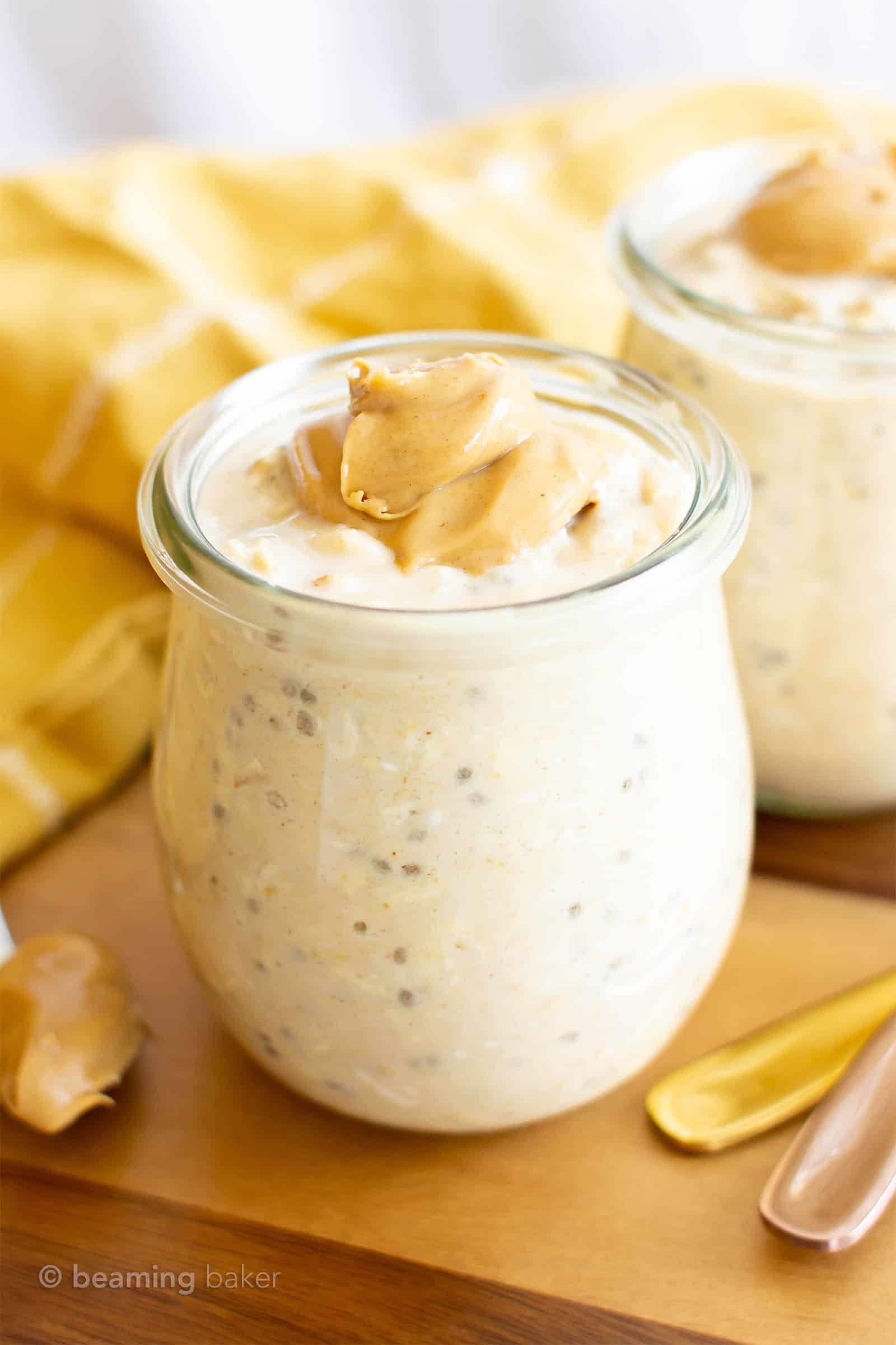 a jar of gluten free overnight oats with two spoons