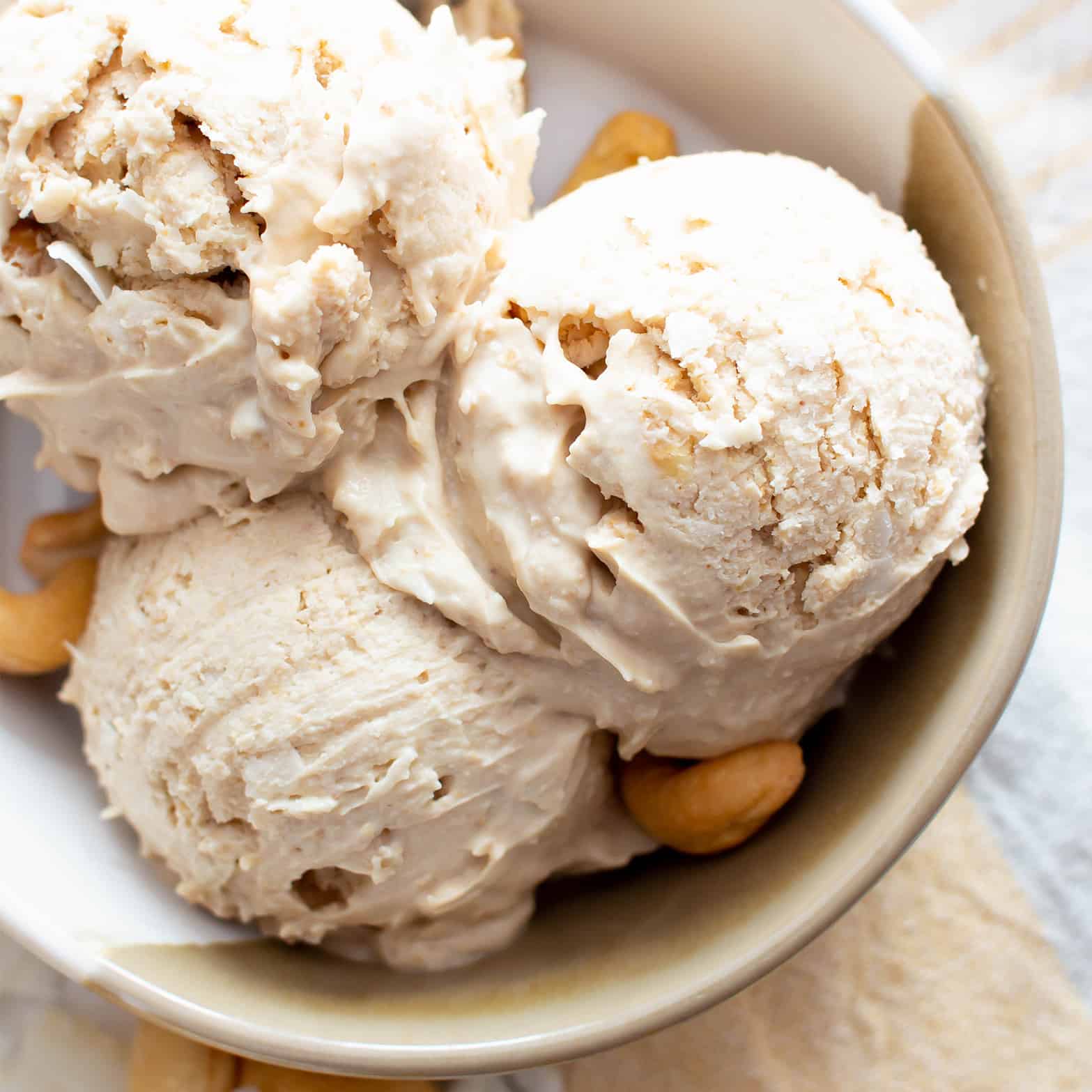 Homemade Cashew Coconut Milk Vegan Ice Cream (Paleo, Dairy-Free): creamy coconut milk-based ice cream packed with cashews & coconut! Make the best keto ice cream in minutes—no soaking cashews, no churn, easy! #Paleo #Keto #Cashews #CoconutMilk #IceCream #Vegan | Recipe at BeamingBaker.com