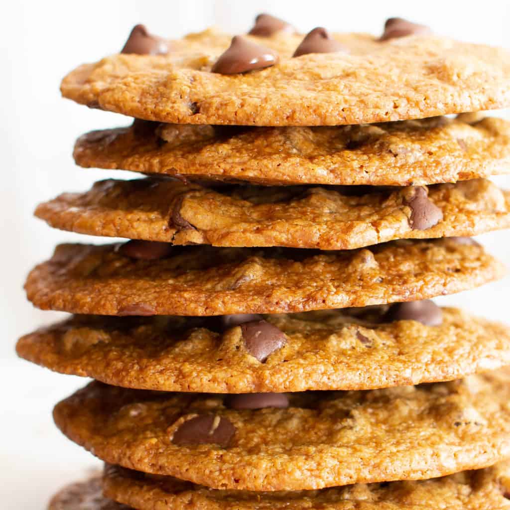 Thin Crispy Vegan Chocolate Chip Cookies (Gluten Free): deliciously thin vegan chocolate chip cookies with crunchy, crispy edges and a buttery chewy center. The BEST thin crispy chocolate chip cookies—that happen to be gluten free and dairy free! #Vegan #GlutenFree #ThinCrispy #ChocolateChip #Cookies | Recipe at BeamingBaker.com