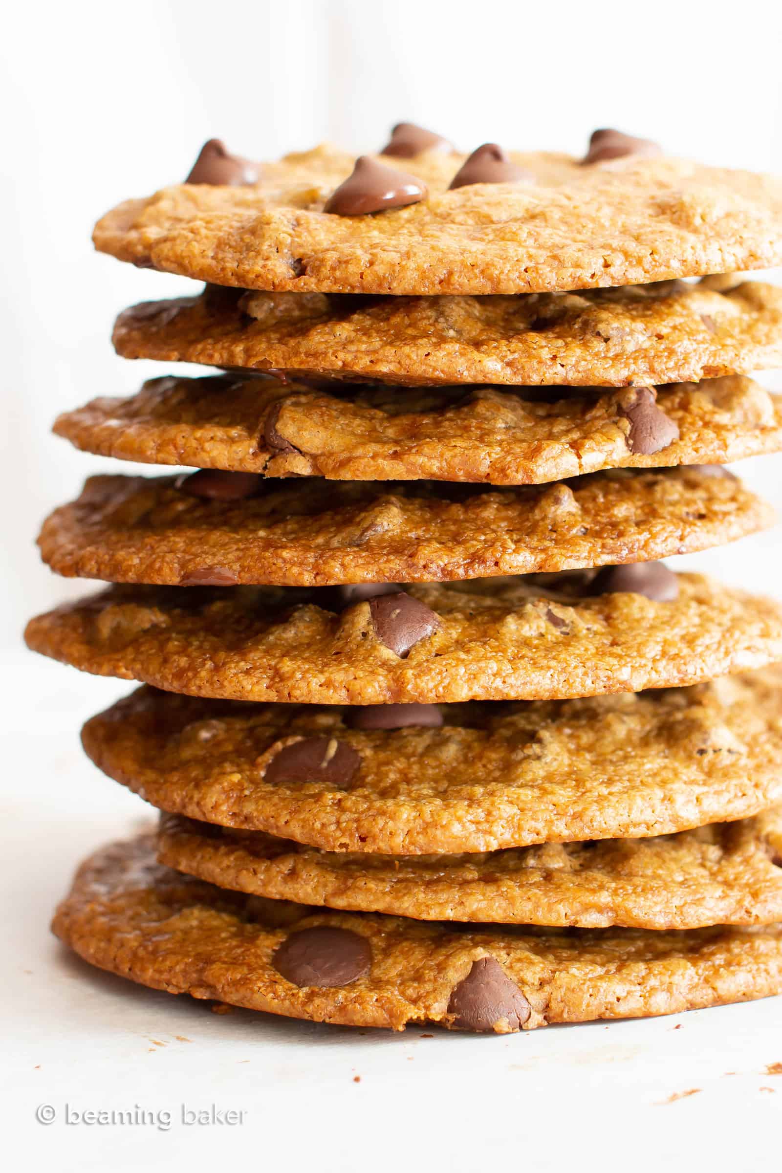 Thin Crispy Vegan Chocolate Chip Cookies (Gluten Free): deliciously thin vegan chocolate chip cookies with crunchy, crispy edges and a buttery chewy center. The BEST thin crispy chocolate chip cookies—that happen to be gluten free and dairy free! #Vegan #GlutenFree #ThinCrispy #ChocolateChip #Cookies | Recipe at BeamingBaker.com