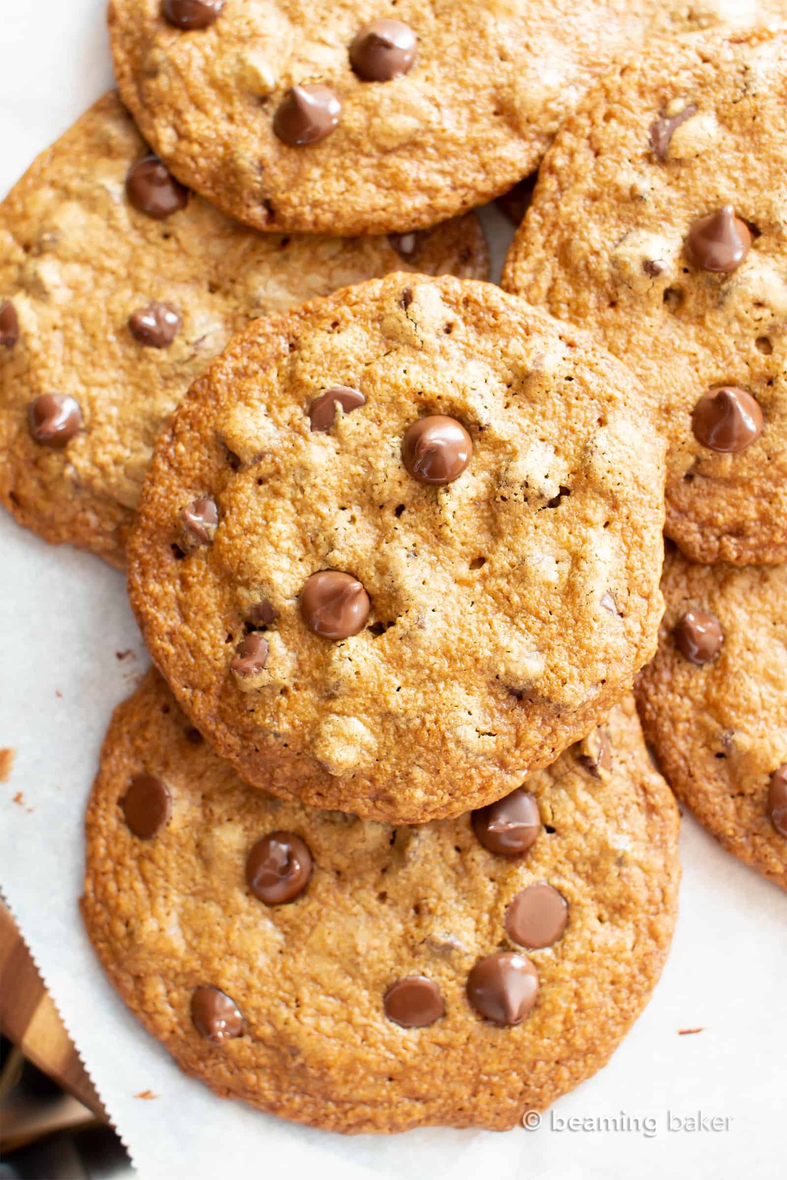 Thin Crispy Vegan Chocolate Chip Cookies (Gluten Free): deliciously thin vegan chocolate chip cookies with crunchy, crispy edges and a buttery chewy center. The BEST thin crispy chocolate chip cookies—that happen to be gluten free and dairy free! #Vegan #GlutenFree #ThinCrispy #ChocolateChip #Cookies | Recipe at BeamingBaker.com