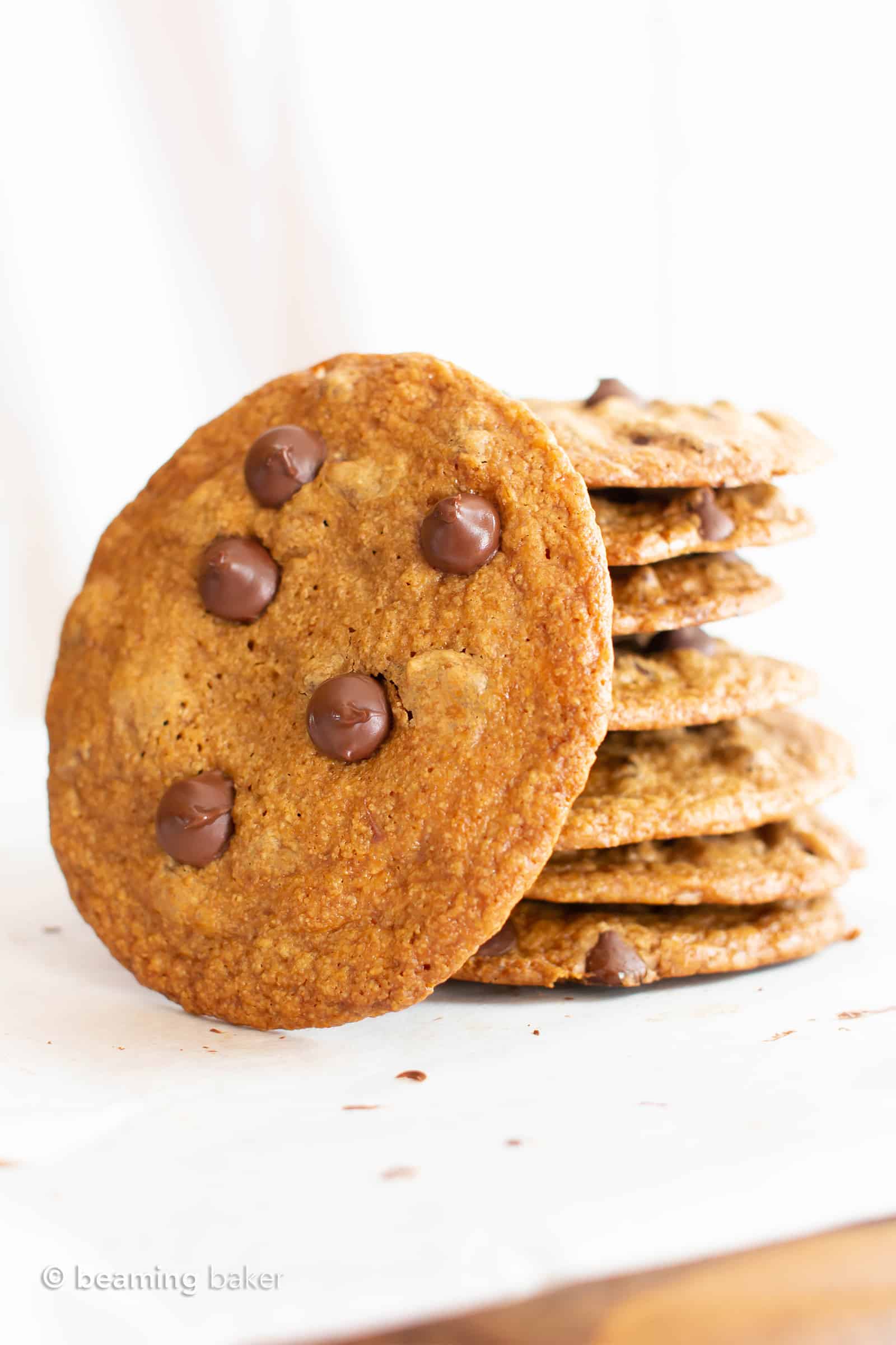 Thin Crispy Vegan Chocolate Chip Cookies (Gluten Free): deliciously thin vegan chocolate chip cookies with crunchy, crispy edges and a buttery chewy center. The BEST thin crispy chocolate chip cookies—that happen to be gluten free and dairy free! #Vegan #GlutenFree #ThinCrispy #ChocolateChip #Cookies | Recipe at BeamingBaker.com