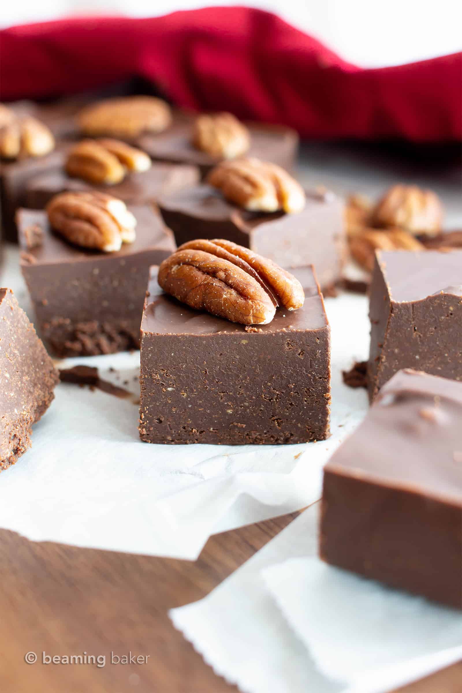 Keto Chocolate Fudge: this low carb chocolate pecan fudge recipe only needs 2 ingredients, is vegan & dairy free! The best 5 minute fudge—for thick squares of sugar free chocolate fudge! Tastes like chocolate covered pecans. #Keto #Fudge #Vegan #LowCarb #SugarFree | Recipe at BeamingBaker.com
