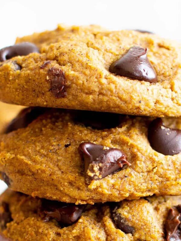 Gluten Free Pumpkin Cookies (Vegan): soft ‘n fluffy gluten free pumpkin cookies bursting with chocolate chips! An easy recipe for moist, cake-like vegan gluten free pumpkin cookies with warm fall spices. #GlutenFree #Pumpkin #Cookies #Vegan | Recipe at BeamingBaker.com 