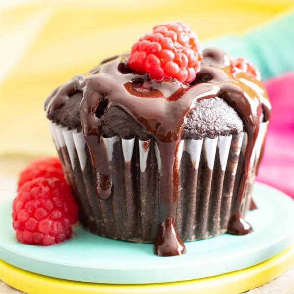 Vegan Dark Chocolate Raspberry Mocha Muffins (GF): decadent, rich, dark chocolate vegan muffins packed with juicy, fresh raspberries, gooey chocolate chips & a coffee kick! #Vegan #Muffins #GlutenFree #Raspberries #DairyFree | Recipe at BeamingBaker.com