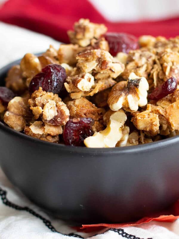 Cranberry Walnut Granola (GF): my favorite GRAINLESS granola—deliciously maple-sweetened crispy, crunchy clusters with tart cranberries & satisfying walnuts! The ultimate homemade GRAIN FREE granola recipe: 10 min prep, Paleo, Vegan, Gluten Free. #GrainFree #Granola #Paleo #Cranberry #GlutenFree | Recipe at BeamingBaker.com