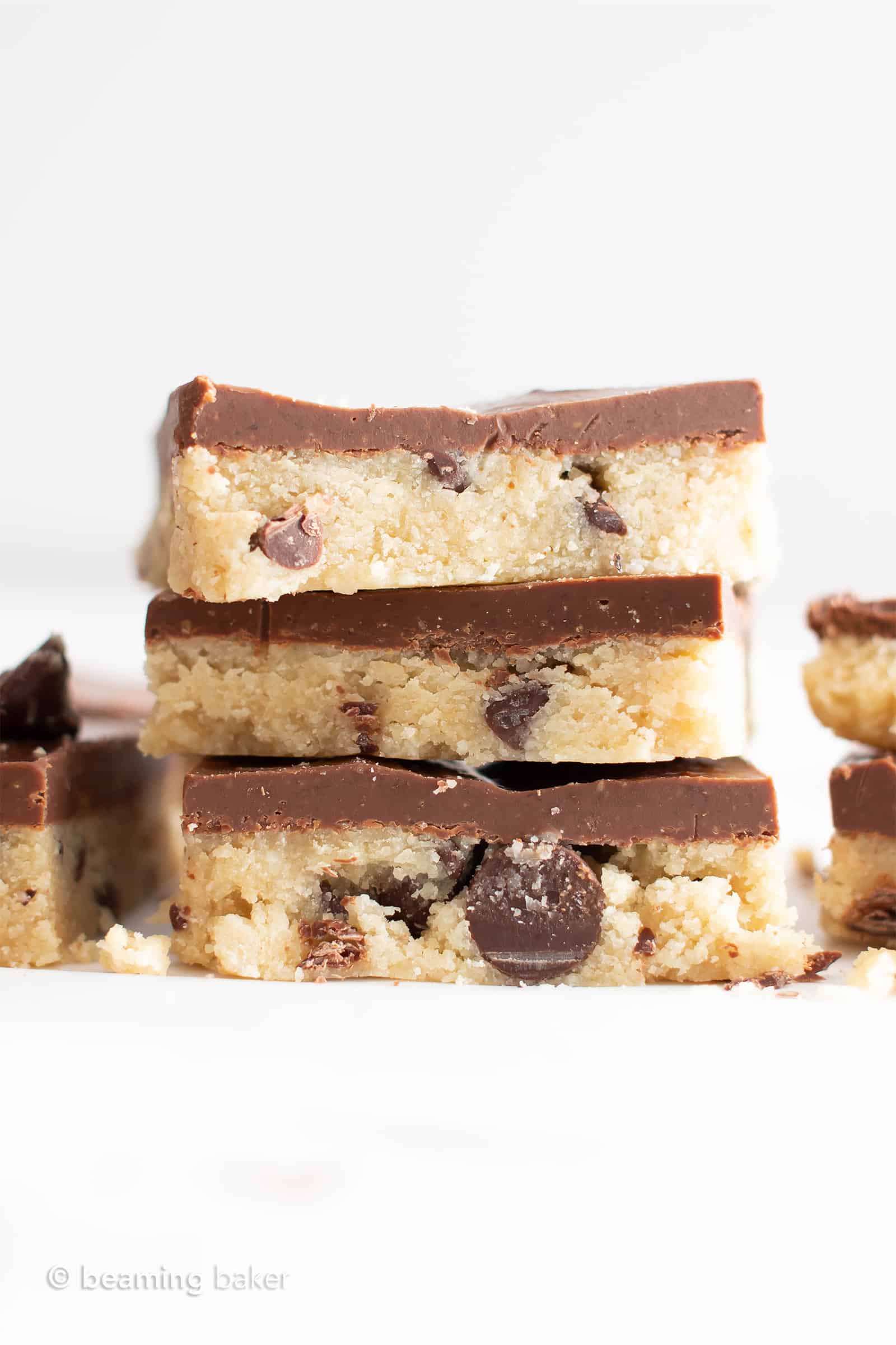 Paleo Cookie Dough Bars (GF): this almond flour cookie dough recipe is delicious & gluten free! Safe to eat & edible, no need to bake. Egg-Free, Vegan, Dairy-Free, Refined Sugar-Free. #Vegan #Paleo #CookieDough #Chocolate | Recipe at BeamingBaker.com