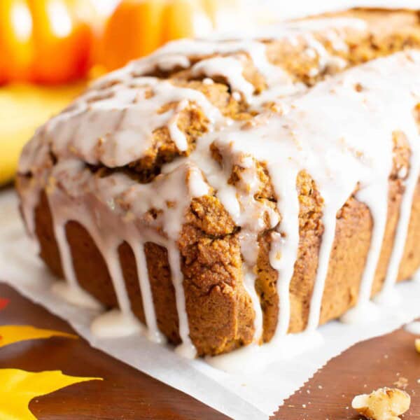 Glazed Vegan Gluten Free Pumpkin Bread Recipe (GF): easy & moist pumpkin bread made in just 1 bowl! The BEST vegan pumpkin bread recipe—flavorful, full of warm spices, made with healthy ingredients and topped with a sweet glaze. #Vegan #Pumpkin #GlutenFree #Bread | Recipe at BeamingBaker.com