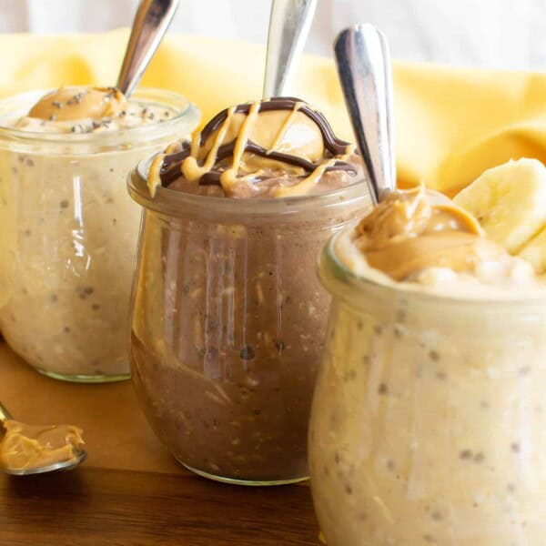 Healthy Peanut Butter Overnight Oats {3 Ways}. Learn how to make peanut butter overnight oats 3 different ways: Chocolate, Banana, and Classic PB! Easy, delicious, Vegan, Gluten-Free, Dairy-Free. #OvernightOats #PeanutButter #Breakfast #Healthy | Recipe at BeamingBaker.com