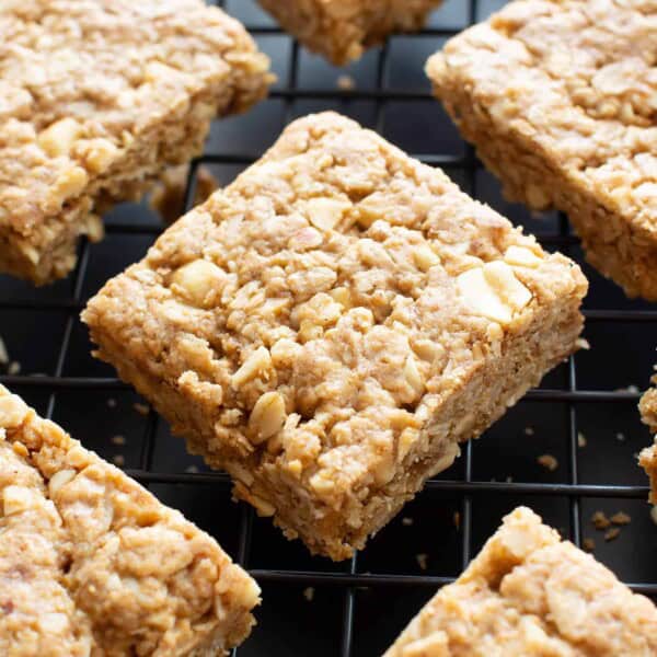 Vegan Oatmeal Peanut Butter Cookie Bars (GF): the best salty & sweet oatmeal cookie bars, with chewy, crispy edges, chopped peanuts, and bursting with Peanut Butter flavor! Gluten-Free, Dairy-Free. #PeanutButter #Oatmeal #Vegan #GlutenFree | Recipe at BeamingBaker.com