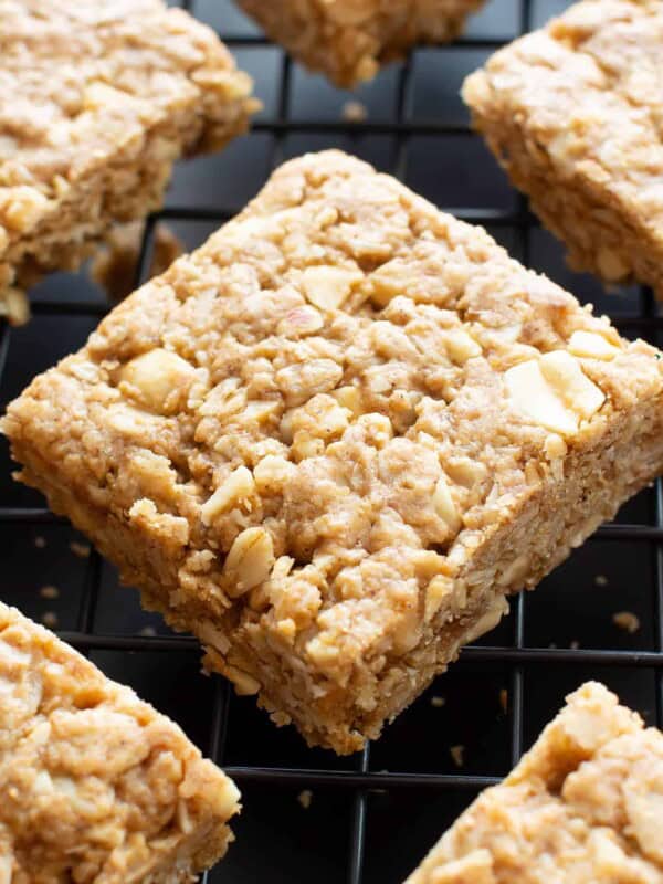 Vegan Oatmeal Peanut Butter Cookie Bars (GF): the best salty & sweet oatmeal cookie bars, with chewy, crispy edges, chopped peanuts, and bursting with Peanut Butter flavor! Gluten-Free, Dairy-Free. #PeanutButter #Oatmeal #Vegan #GlutenFree | Recipe at BeamingBaker.com