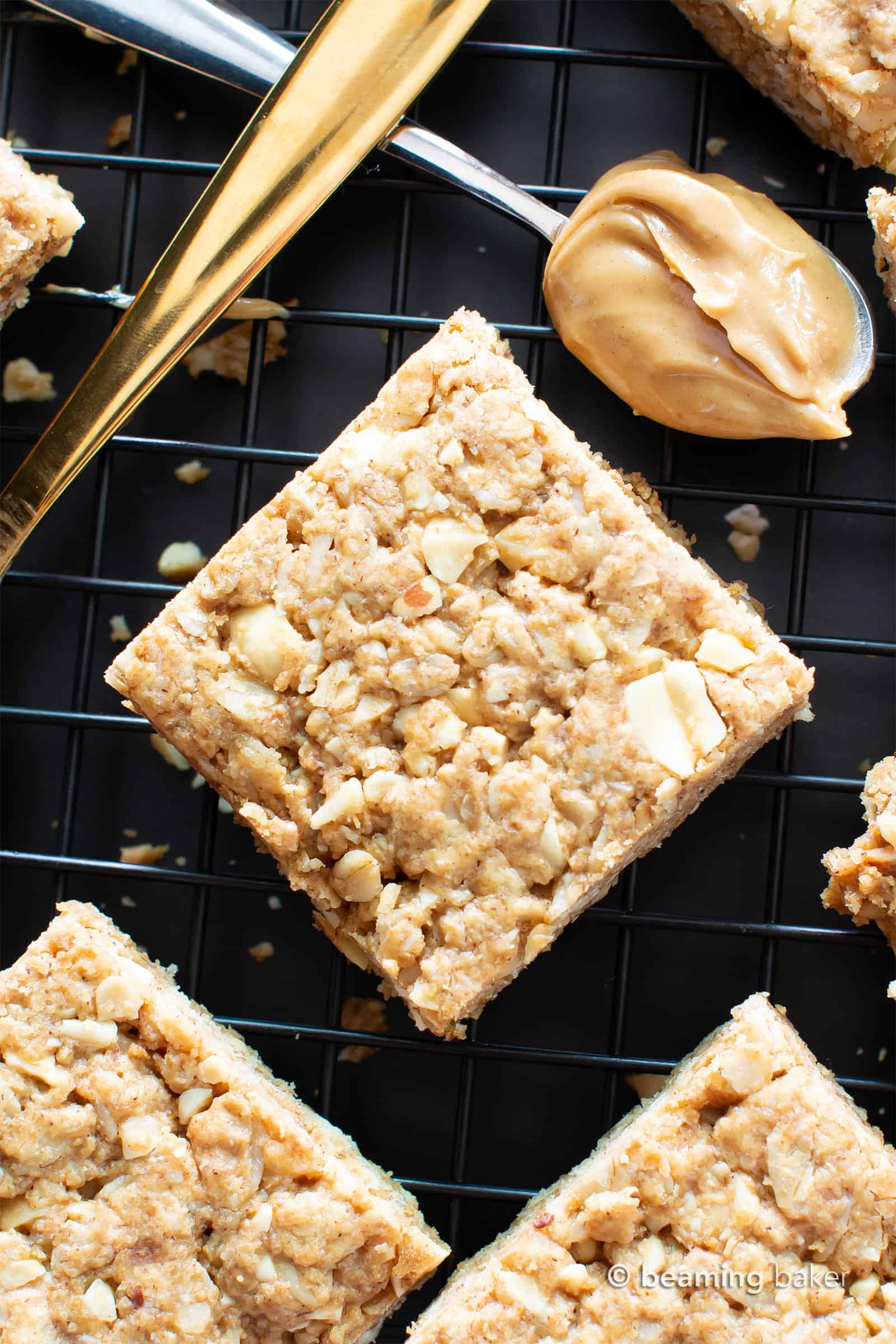 Vegan Oatmeal Peanut Butter Cookie Bars (GF): the best salty & sweet oatmeal cookie bars, with chewy, crispy edges, chopped peanuts, and bursting with Peanut Butter flavor! Gluten-Free, Dairy-Free. #PeanutButter #Oatmeal #Vegan #GlutenFree | Recipe at BeamingBaker.com