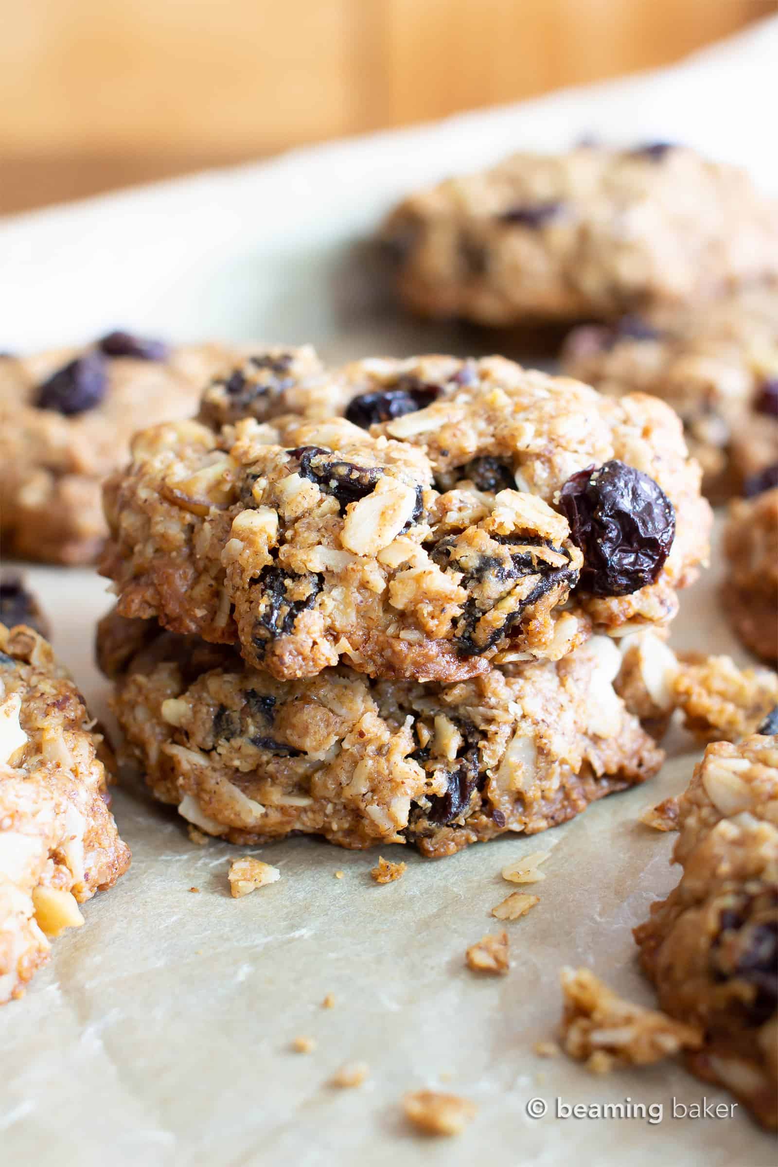 The BEST VEGAN chewy oatmeal raisin cookies EVER--crispy edges with a CHEWY center, bursting with oats, warm spices & juicy raisins! Gluten-Free, Healthy Ingredients! #Vegan #Cookies #OatmealRaisin #GlutenFree | Recipe at BeamingBaker.com