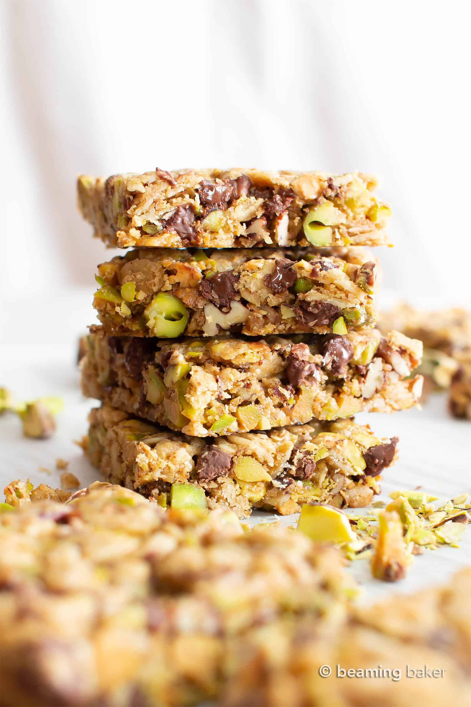 Chocolate Pistachio Healthy Vegan Snack Bars (GF): soft & chewy Gluten Free Vegan snack bars packed with chocolate & pistachios! The perfect nutty snack—easy to make, simple ingredients for the BEST vegan snack bars! Dairy-Free, Refined Sugar-Free. #Snacks #Vegan #GlutenFree #HealthySnacks | Recipe at BeamingBaker.com