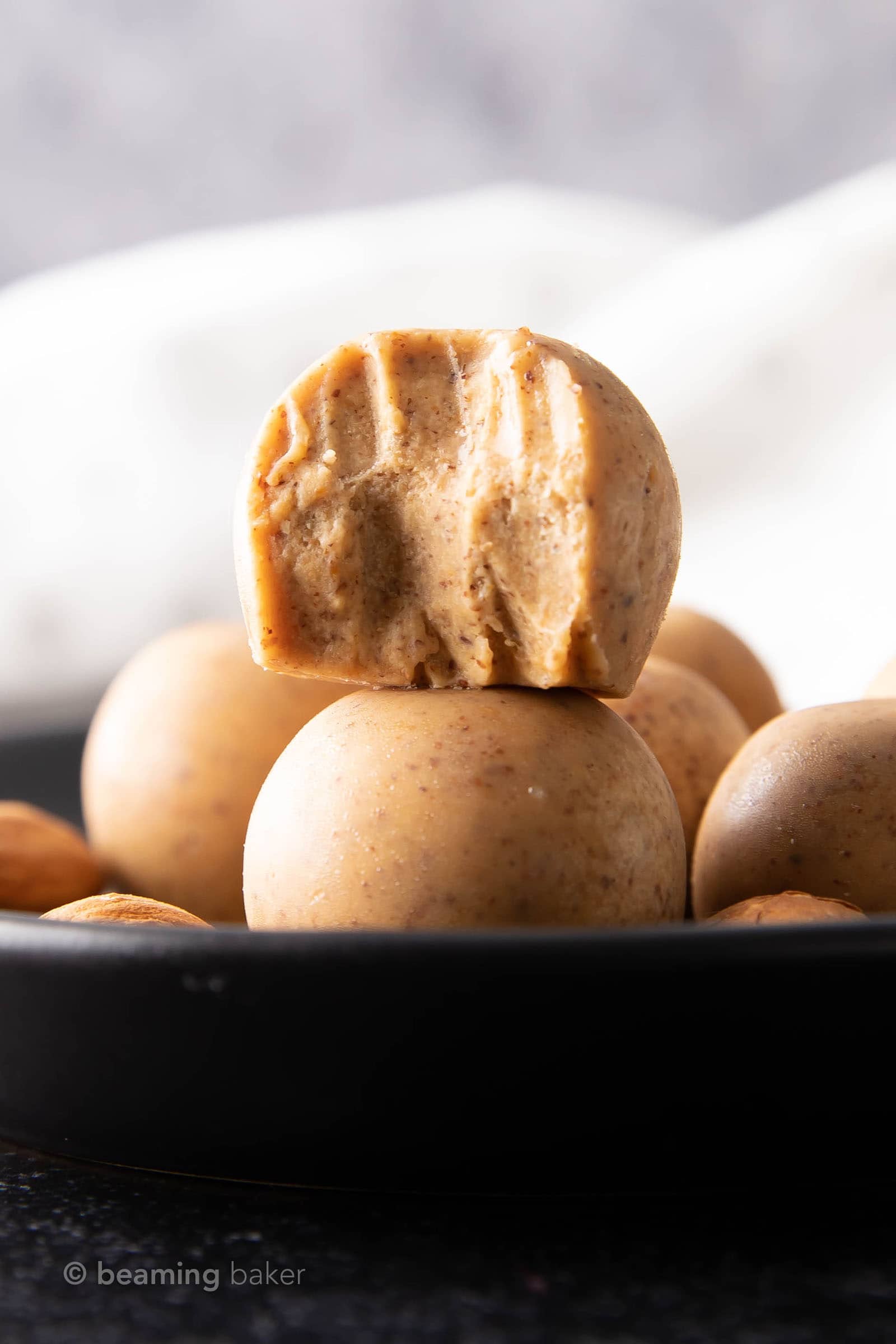 Almond Butter Keto Fat Bomb Recipe: a quick & easy recipe for the best keto fat bombs—only 3 ingredients & 5 mins to prep. Deliciously creamy, satisfying almond butter fat bombs that are: Low Carb, Keto, Vegan. #Keto #FatBombs #NoBake #AlmondButter #LowCarb | Recipe at BeamingBaker.com