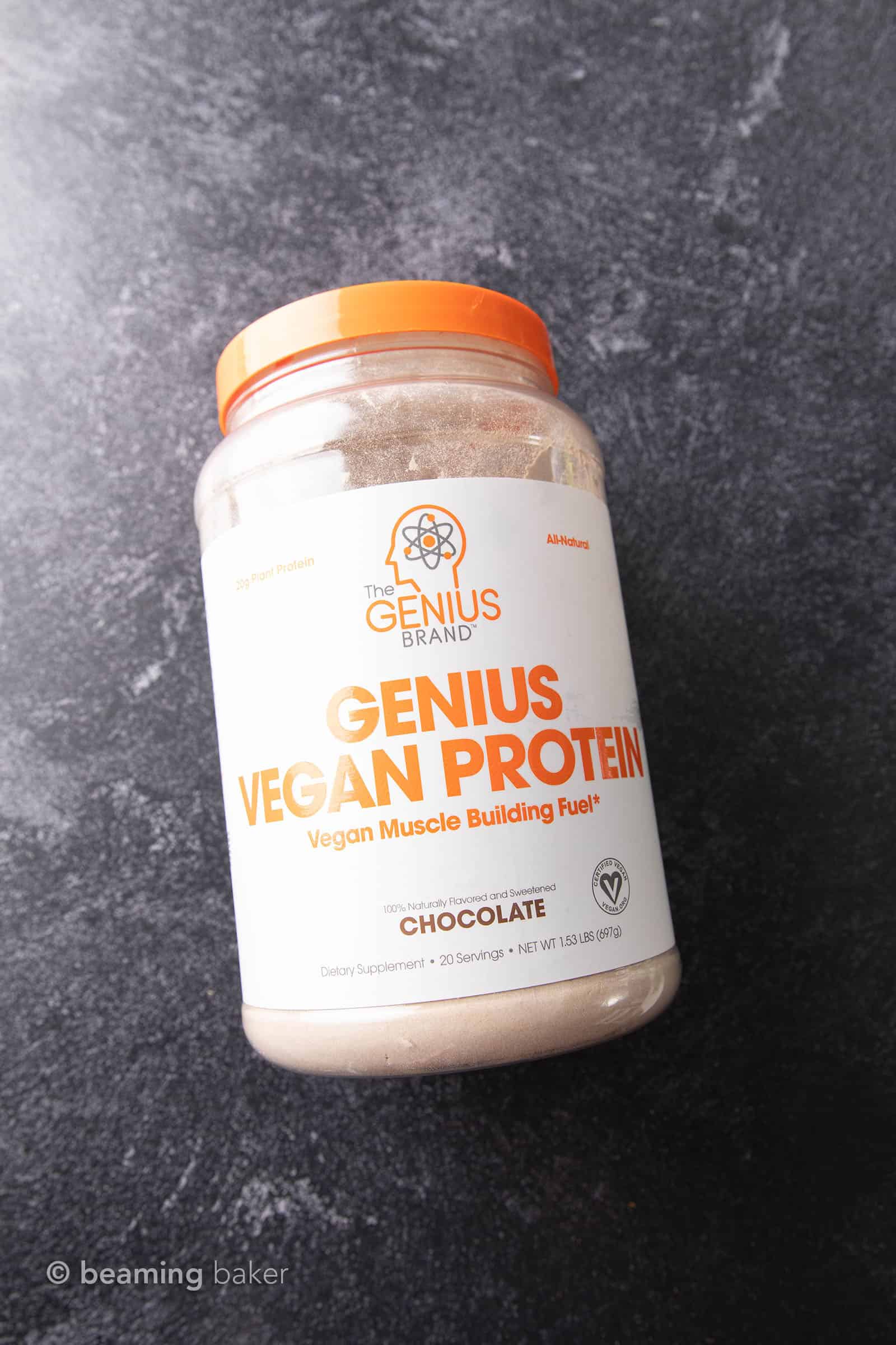 Bottle of Genius Vegan Chocolate Protein Powder