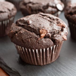 Paleo Chocolate Muffins: moist Gluten Free chocolate muffins with almond flour, tons of chocolate & crispy tops! Easy, Grain-Free, Vegan, Healthy ingredients. #Paleo #Muffins #GlutenFree #Chocolate | Recipe at BeamingBaker.com