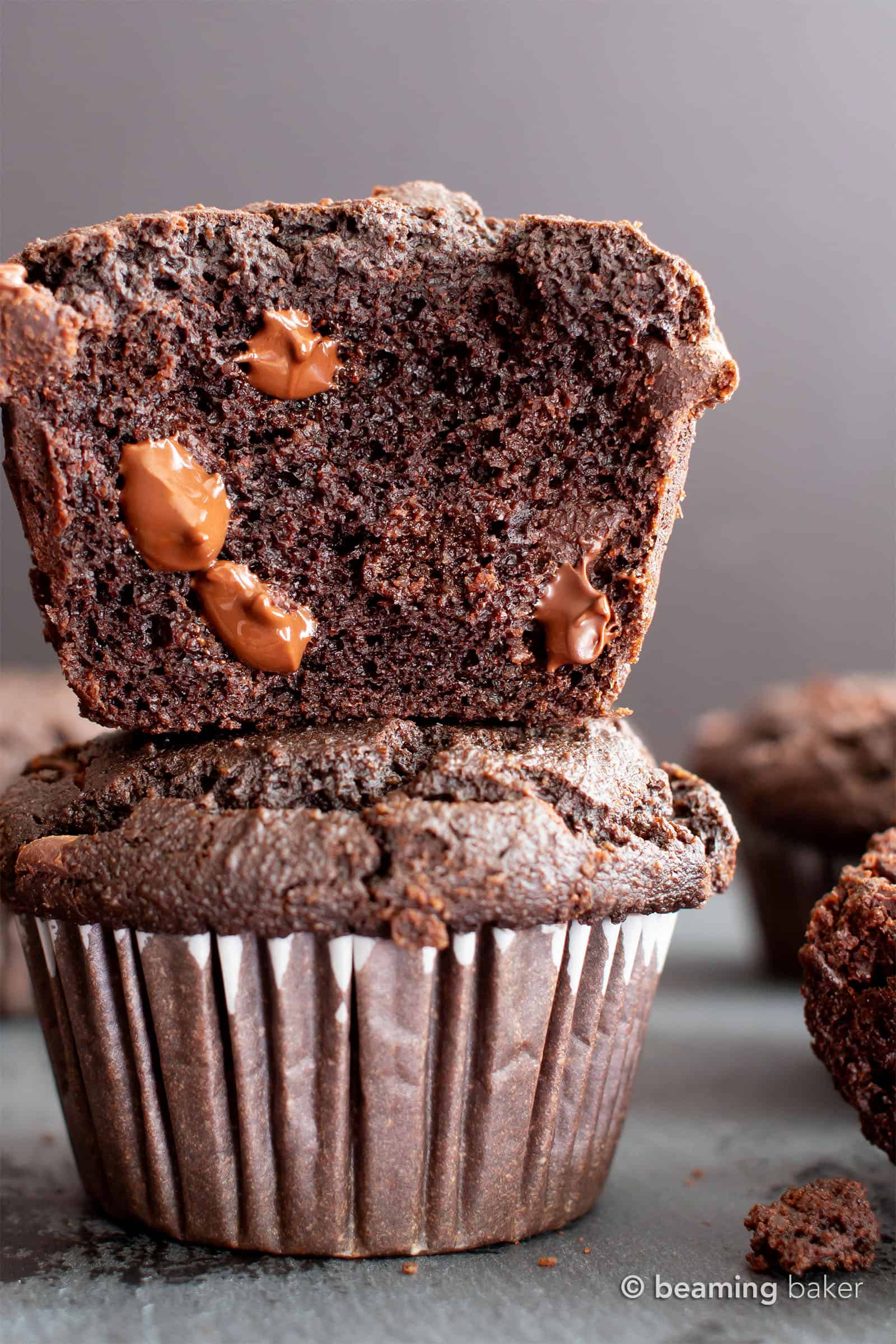 Paleo Chocolate Muffins: moist Gluten Free chocolate muffins with almond flour, tons of chocolate & crispy tops! Easy, Grain-Free, Vegan, Healthy ingredients. #Paleo #Muffins #GlutenFree #Chocolate | Recipe at BeamingBaker.com