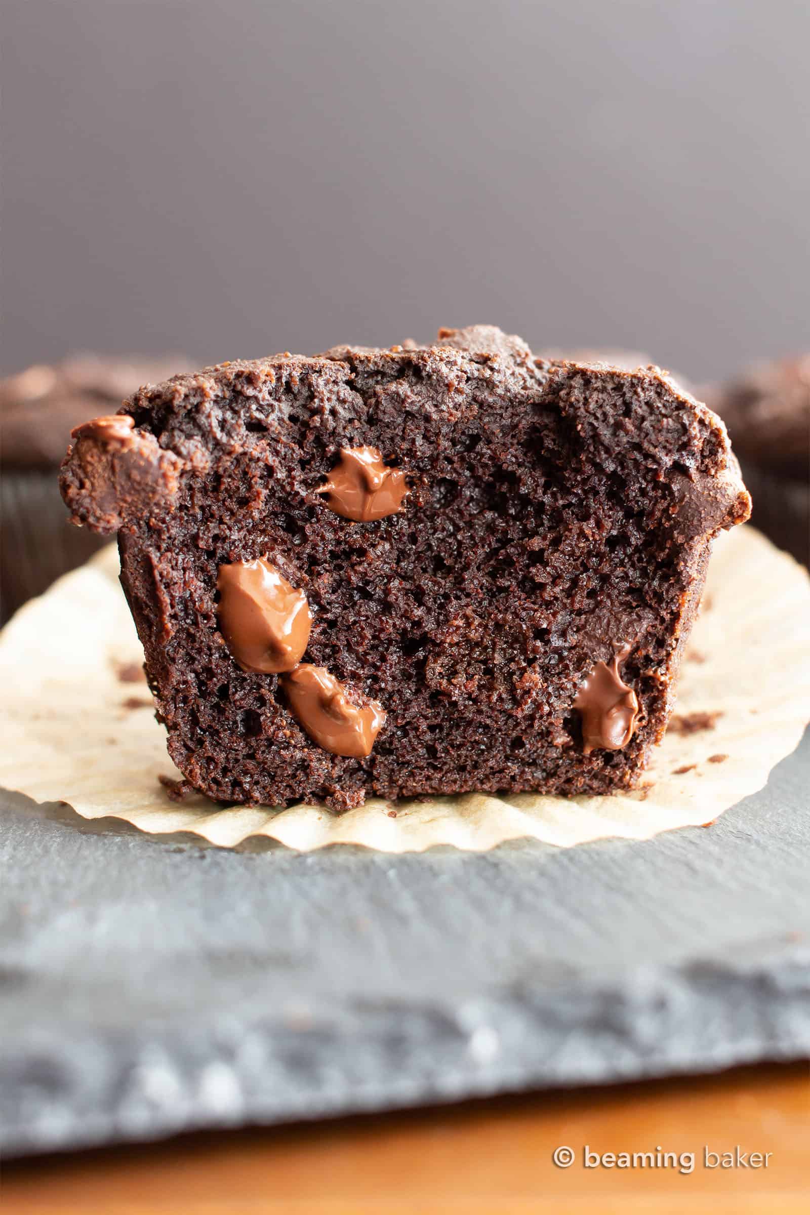 Paleo Chocolate Muffins: moist Gluten Free chocolate muffins with almond flour, tons of chocolate & crispy tops! Easy, Grain-Free, Vegan, Healthy ingredients. #Paleo #Muffins #GlutenFree #Chocolate | Recipe at BeamingBaker.com