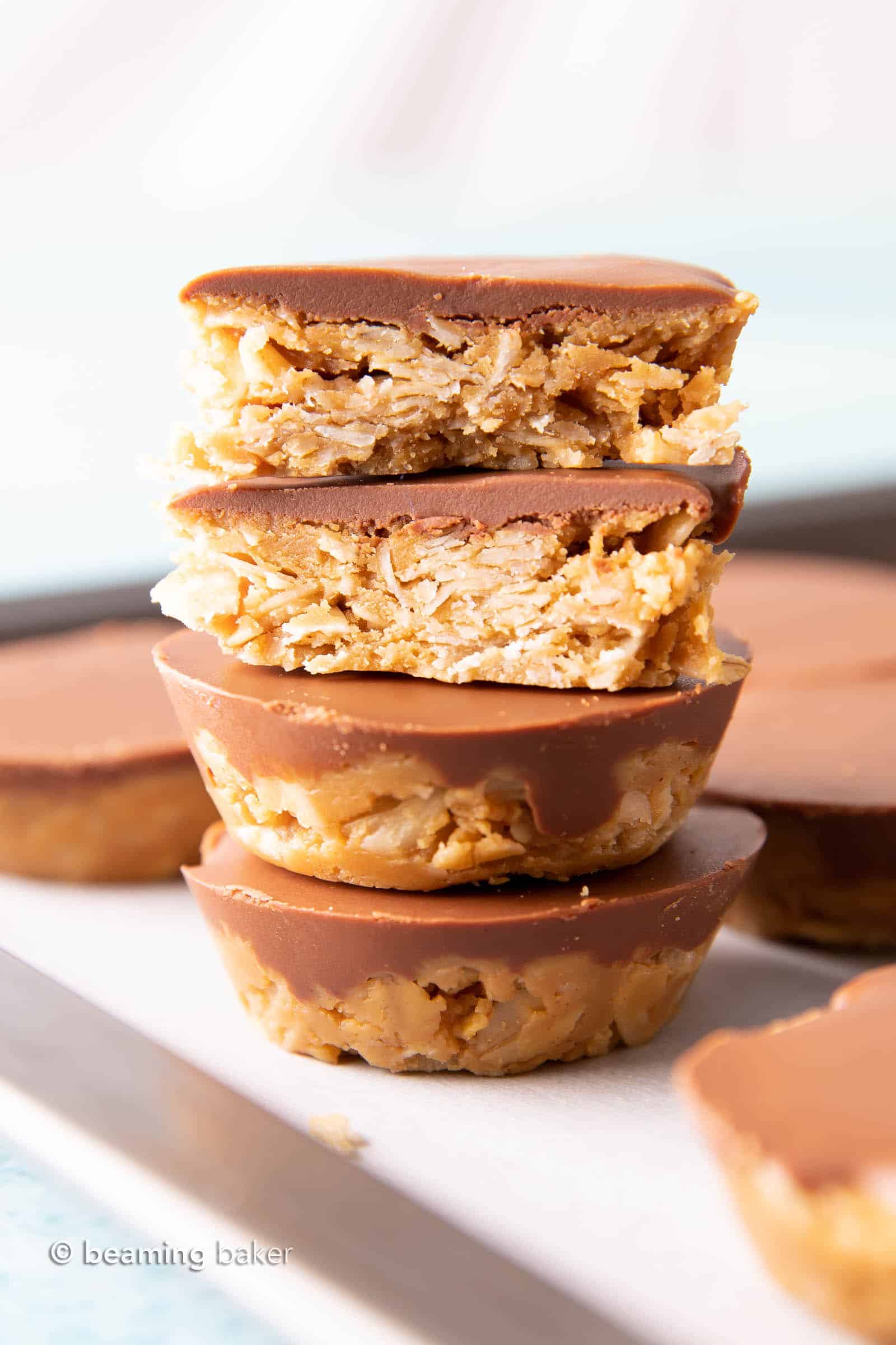 No Bake Chocolate Peanut Butter Oatmeal Cups (GF): an easy, 4 ingredient recipe for chocolate PB oatmeal cups! A delicious on-the-go snack that’s packed with healthy ingredients & protein-rich YUM. #PeanutButter #NoBake #Chocolate #Oatmeal | Recipe at BeamingBaker.com