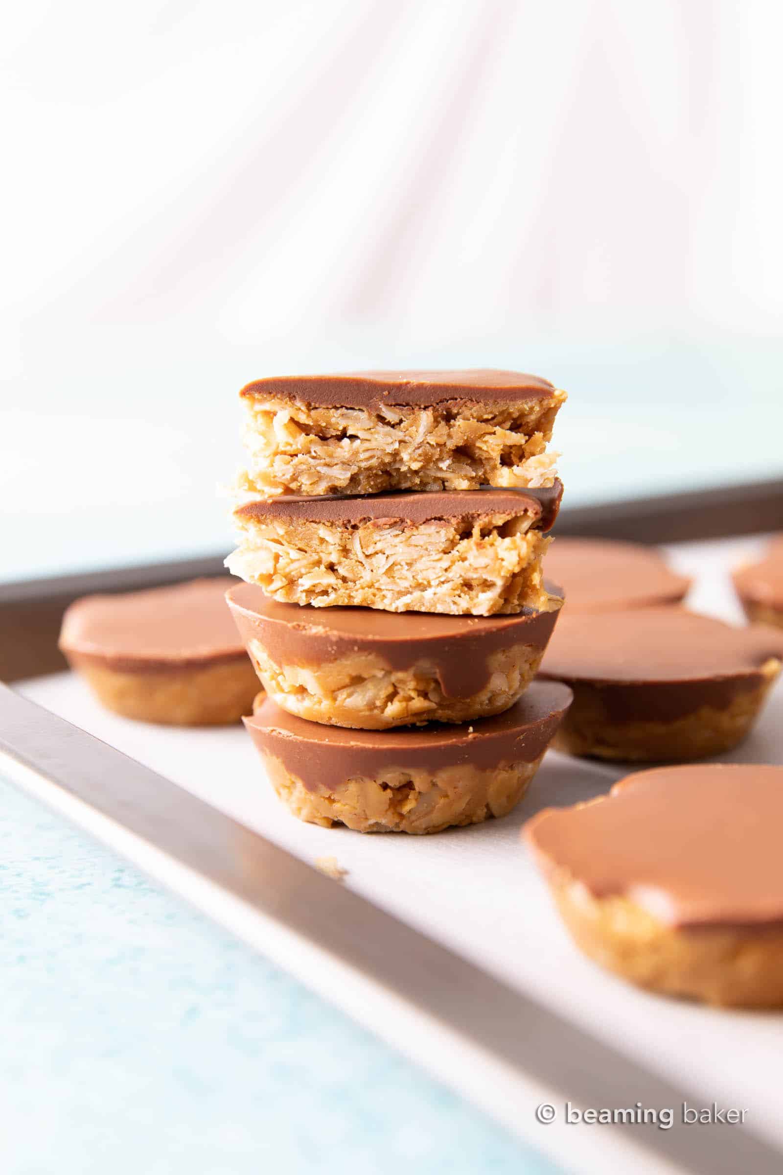 No Bake Chocolate Peanut Butter Oatmeal Cups (GF): an easy, 4 ingredient recipe for chocolate PB oatmeal cups! A delicious on-the-go snack that’s packed with healthy ingredients & protein-rich YUM. #PeanutButter #NoBake #Chocolate #Oatmeal | Recipe at BeamingBaker.com