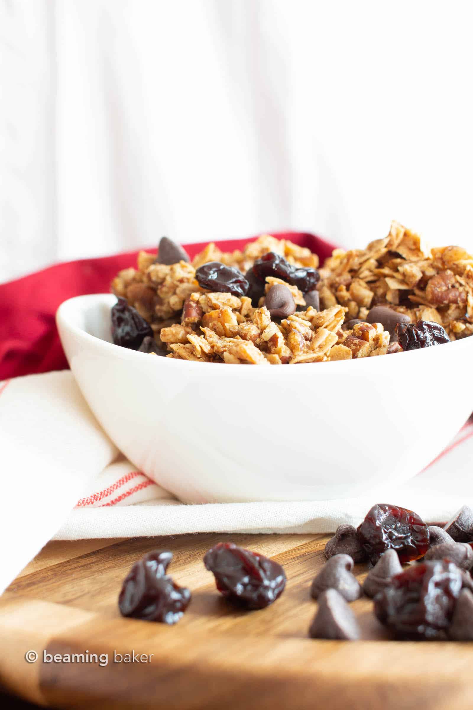 Healthy Granola Recipe with Cherries & Chocolate: the best EASY healthy granola recipe with BIG chunky clusters, packed full of nutty crunch, satisfying chewy oats, tart & sweet cherries with chocolate! #Granola #Healthy #Snacks #Vegan | Recipe at BeamingBaker.com