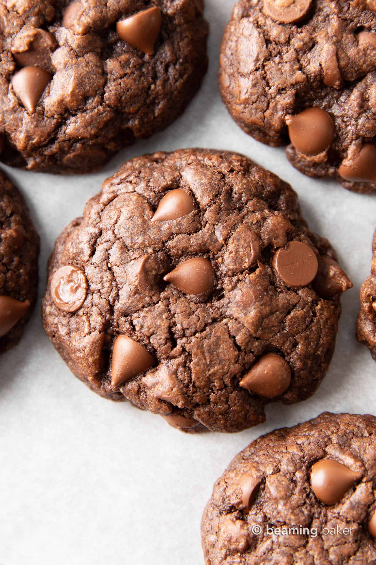 Gluten Free Chocolate Cookies: chewy & moist gluten free brownie cookies with a crispy exterior and LOTS of chocolate packed in! The BEST gluten free chocolate brownie cookie recipe EVER. #Brownies #GlutenFree #Cookies #Vegan | Recipe at BeamingBaker.com