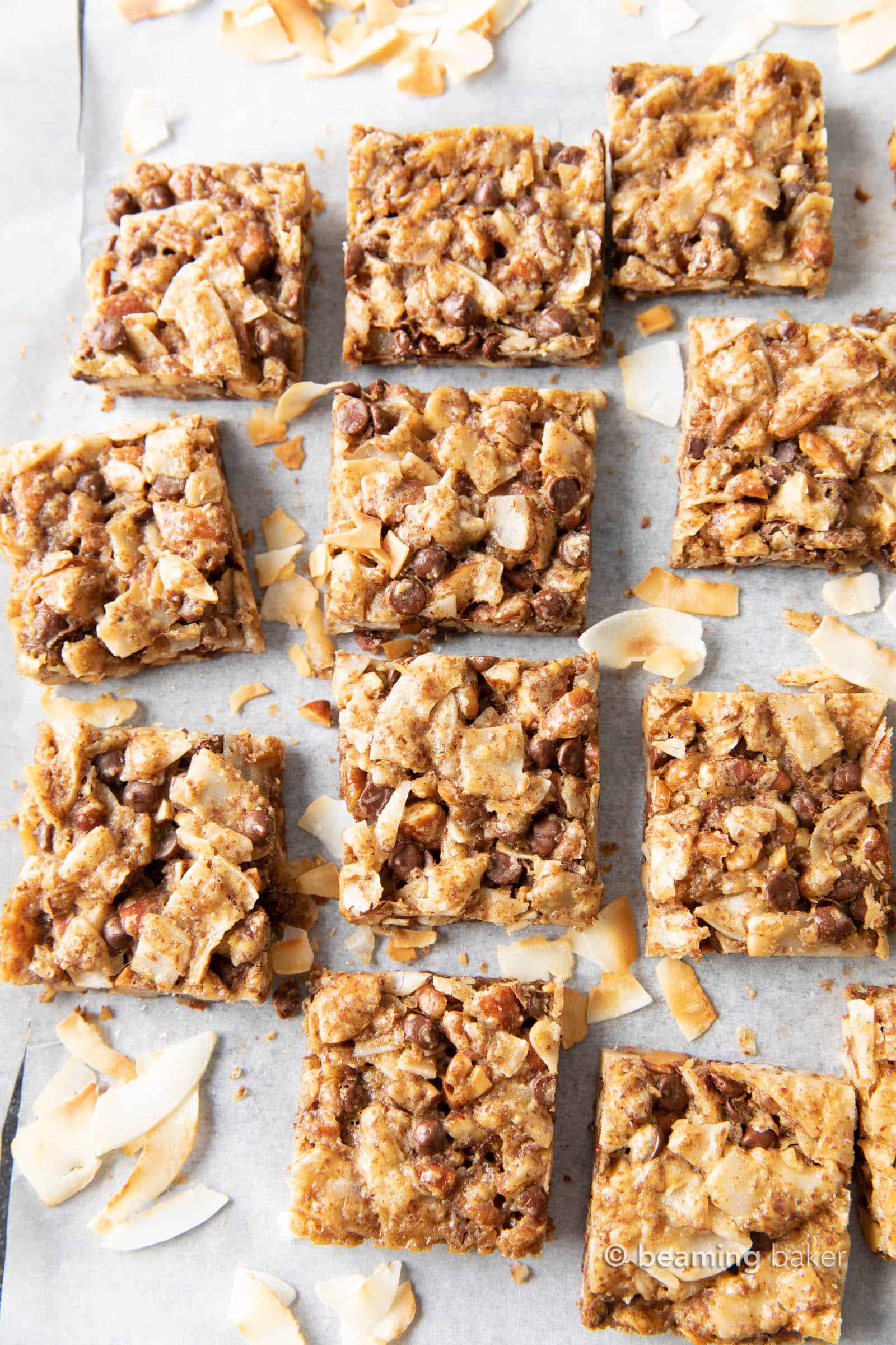 Coconut Granola Bars (Paleo): chewy & healthy homemade granola bars bursting with coconut & nuts! Deliciously healthy granola bars—Paleo, Grain-Free, Vegan, Gluten Free. #GranolaBars #Paleo #Healthy #Vegan | Recipe at BeamingBaker.com