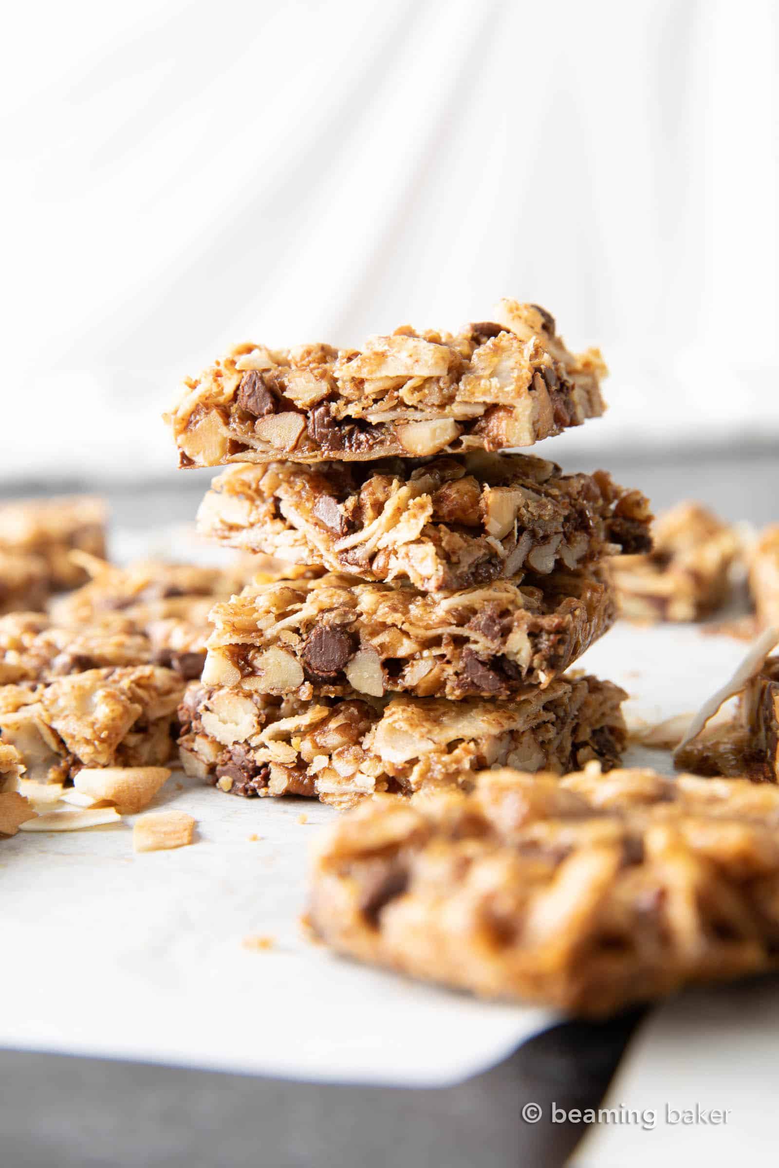 Coconut Granola Bars (Paleo): chewy & healthy homemade granola bars bursting with coconut & nuts! Deliciously healthy granola bars—Paleo, Grain-Free, Vegan, Gluten Free. #GranolaBars #Paleo #Healthy #Vegan | Recipe at BeamingBaker.com