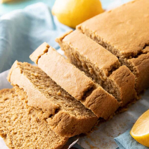 Easy Vegan Lemon Loaf: this dairy free lemon loaf is moist & fluffy, bursting with bright lemon flavor. Easy to make, Plant-Based ingredients, Gluten Free. #Lemon #Vegan #GlutenFree #Healthy | Recipe at BeamingBaker.com