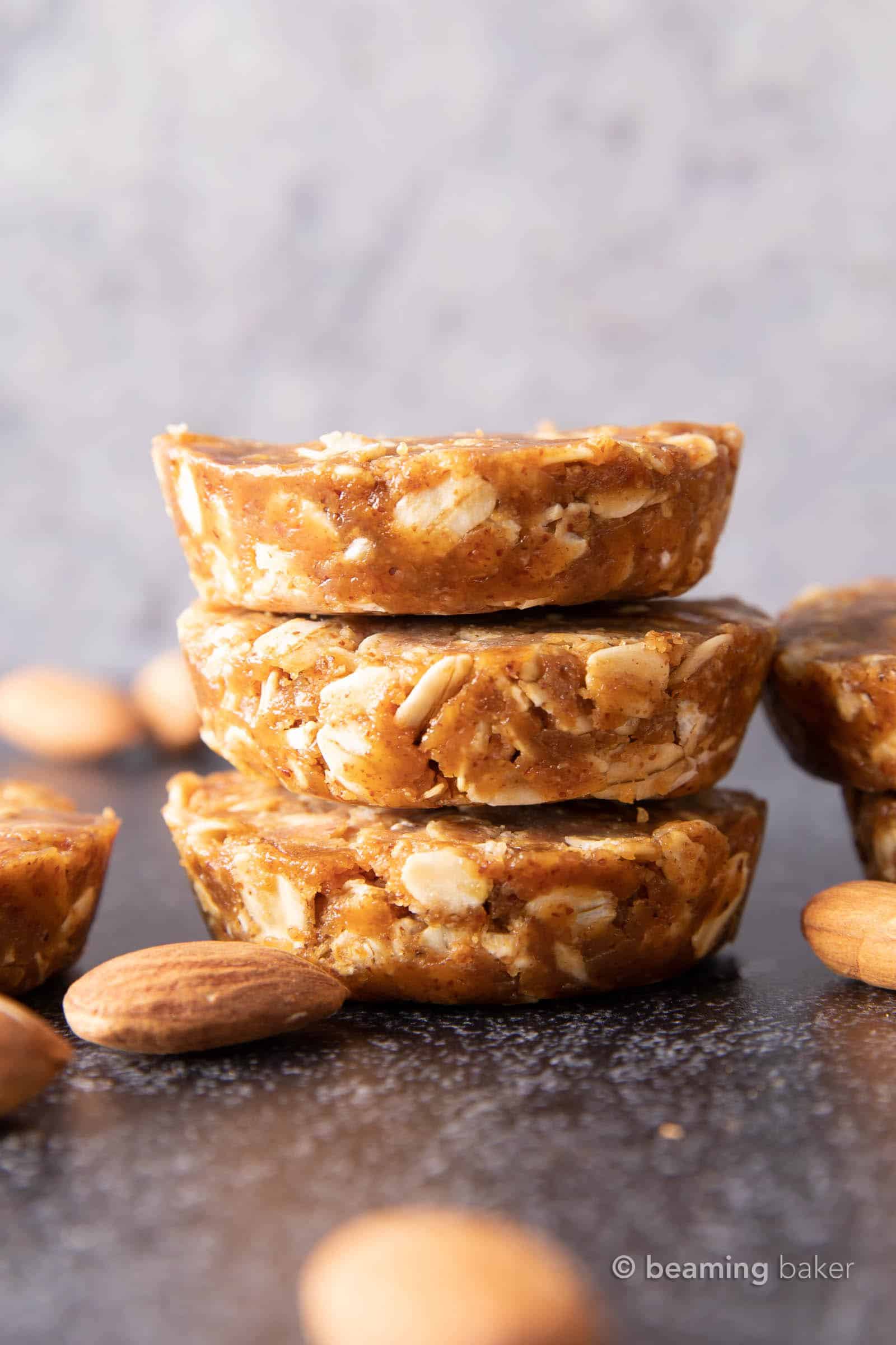 Easy Oatmeal Cups with Almond Butter: this 3 ingredient No Bake oatmeal cups recipe yields soft & chewy oatmeal cups—the perfect Quick ‘n Easy snack on-the-go! Vegan, Gluten Free. #PeanutButter #Oatmeal #NoBake #HealthySnacks | Recipe at BeamingBaker.com