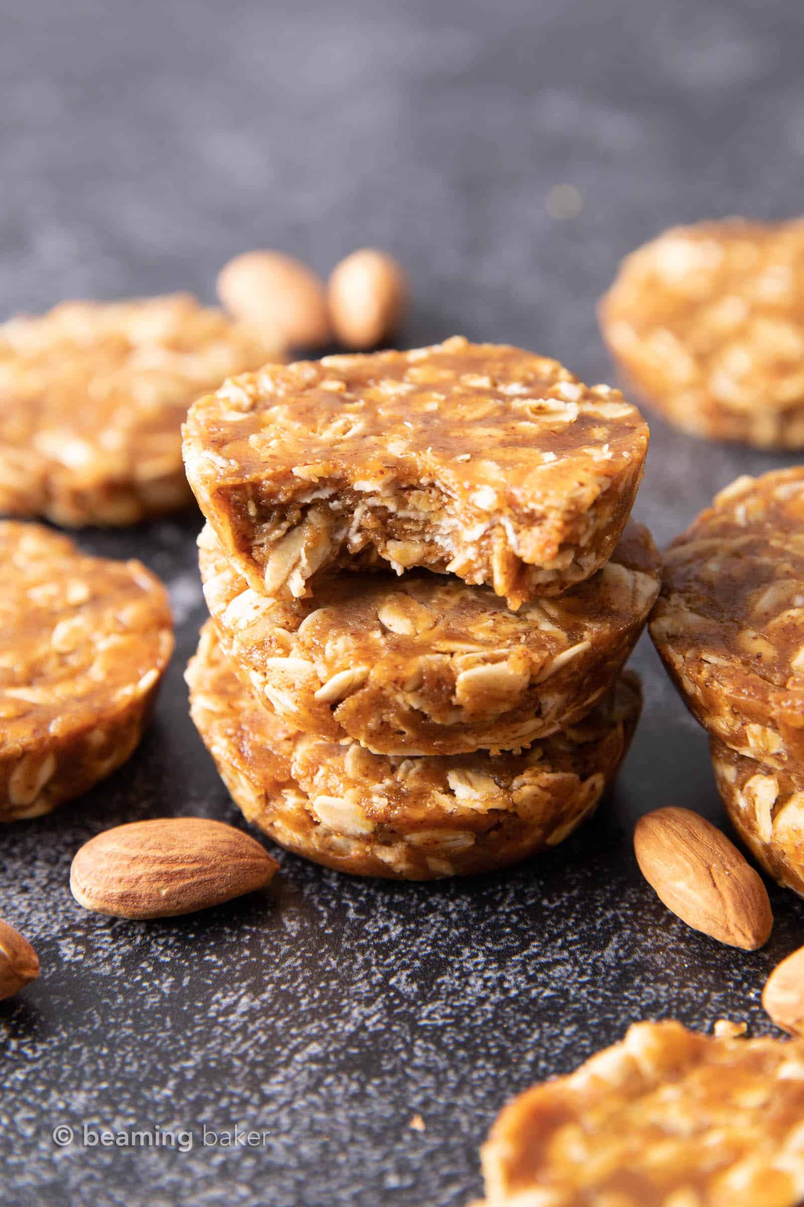 Easy Oatmeal Cups with Almond Butter: this 3 ingredient No Bake oatmeal cups recipe yields soft & chewy oatmeal cups—the perfect Quick ‘n Easy snack on-the-go! Vegan, Gluten Free. #PeanutButter #Oatmeal #NoBake #HealthySnacks | Recipe at BeamingBaker.com