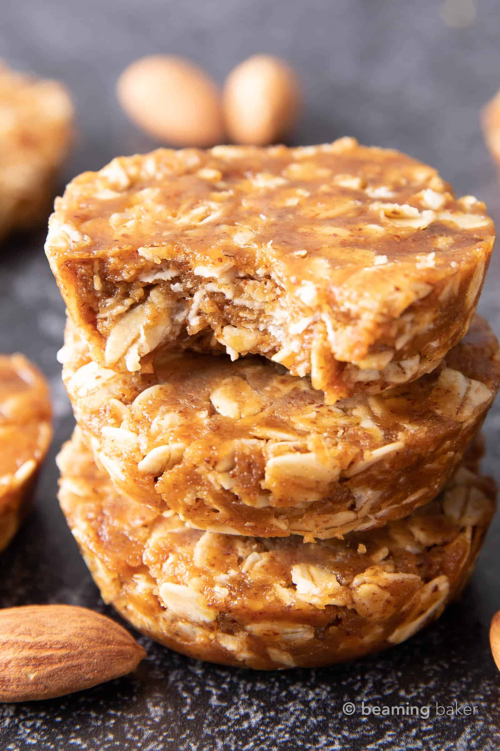 Easy Oatmeal Cups with Almond Butter: this 3 ingredient No Bake oatmeal cups recipe yields soft & chewy oatmeal cups—the perfect Quick ‘n Easy snack on-the-go! Vegan, Gluten Free. #PeanutButter #Oatmeal #NoBake #HealthySnacks | Recipe at BeamingBaker.com