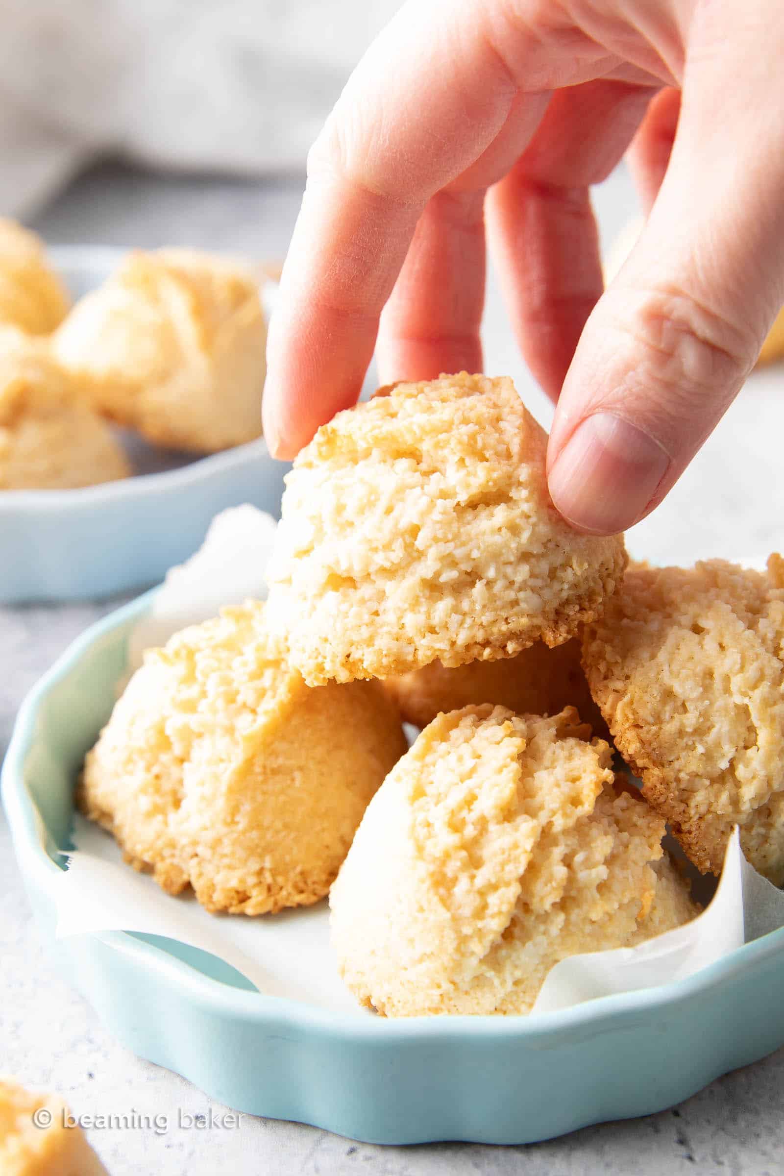 Gluten Free Coconut Macaroons Recipe: this easy gluten free macaroons recipe yields soft & chewy coconut cookies with a crispy exterior! Vegan, Paleo, Dairy-Free, Egg-Free. #Coconut #Macaroons #GlutenFree #Cookies | Recipe at BeamingBaker.com