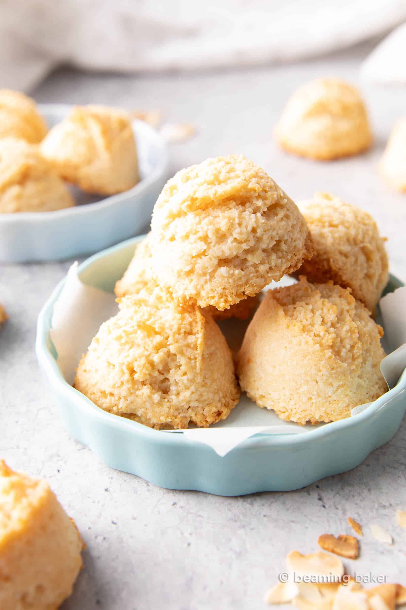 Gluten Free Coconut Macaroons Recipe: this easy gluten free macaroons recipe yields soft & chewy coconut cookies with a crispy exterior! Vegan, Paleo, Dairy-Free, Egg-Free. #Coconut #Macaroons #GlutenFree #Cookies #Easter | Recipe at BeamingBaker.com