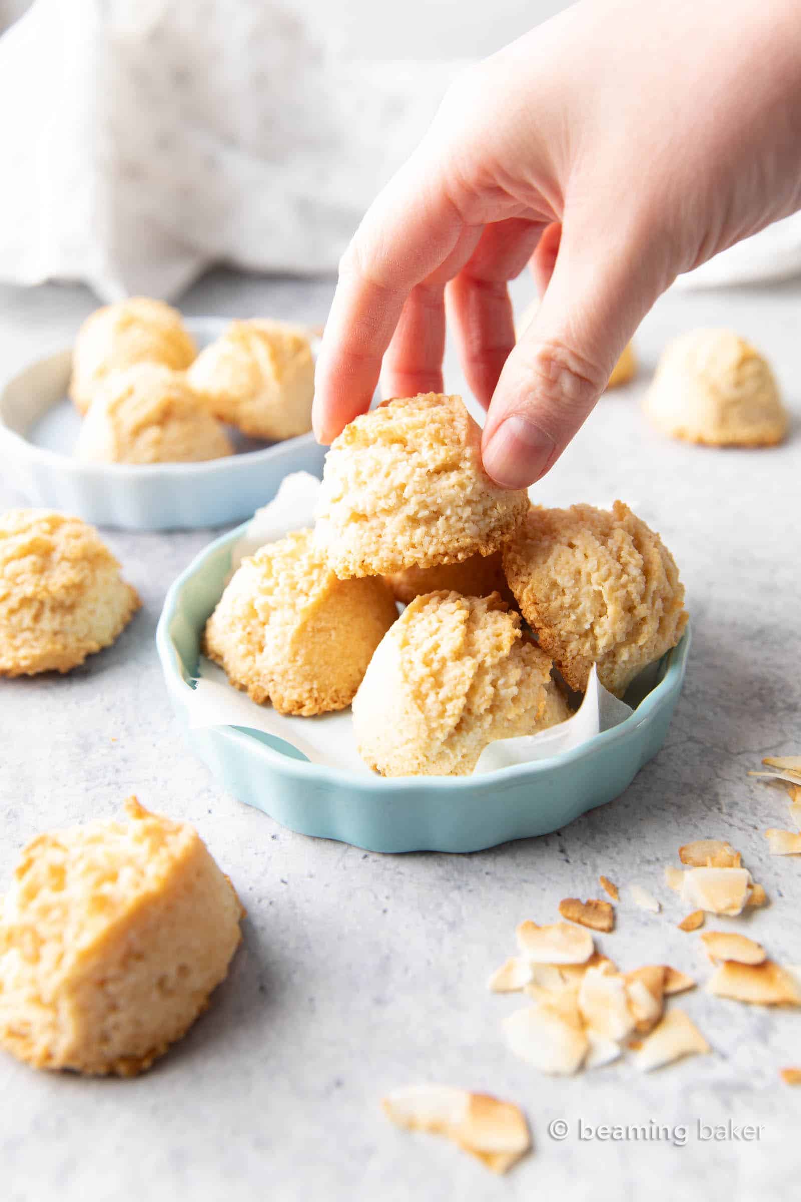 Gluten Free Coconut Macaroons Recipe: this easy gluten free macaroons recipe yields soft & chewy coconut cookies with a crispy exterior! Vegan, Paleo, Dairy-Free, Egg-Free. #Coconut #Macaroons #GlutenFree #Cookies #Easter | Recipe at BeamingBaker.com