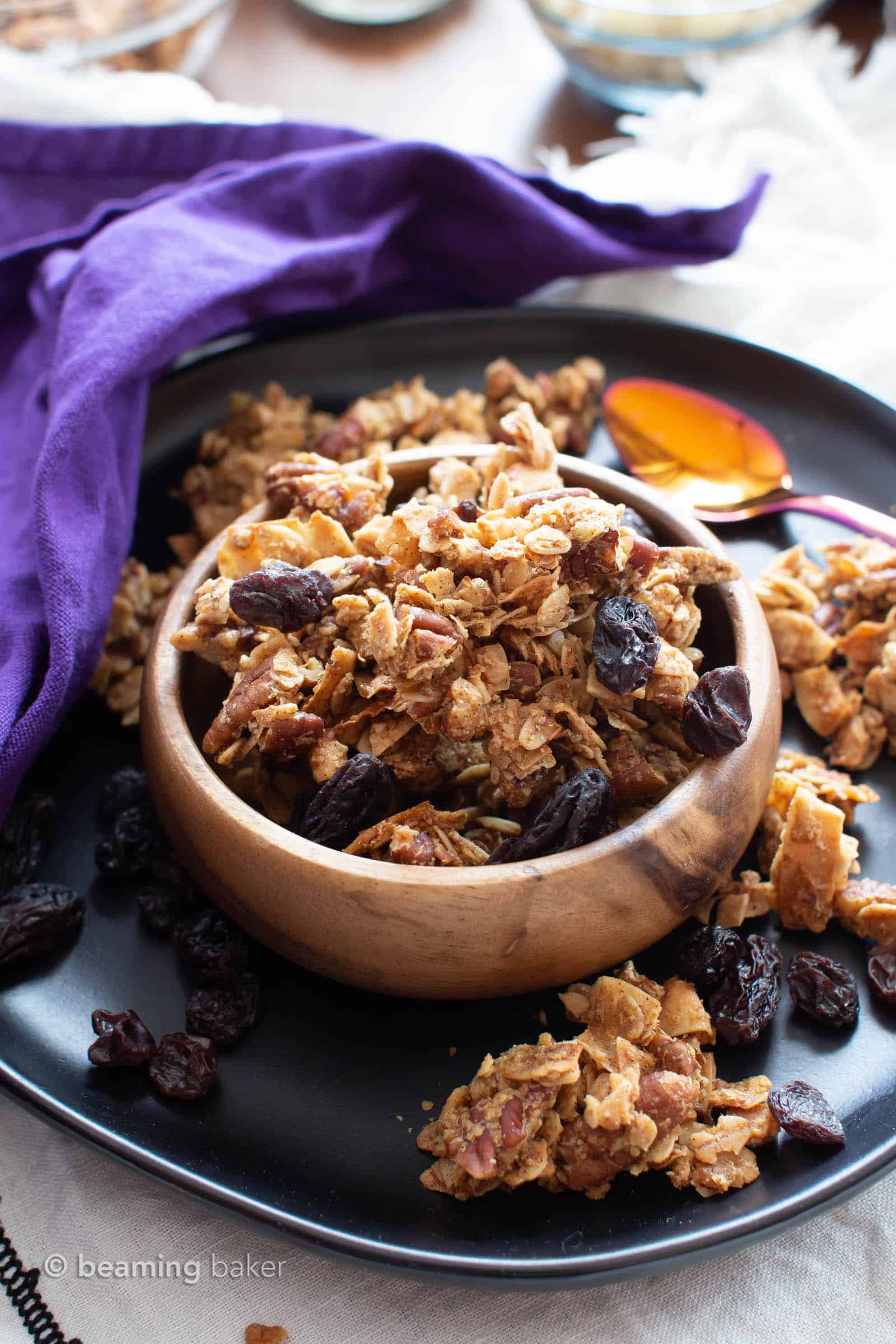 Oatmeal Raisin Vegan Granola Recipe: super CHUNKY, big cluster homemade vegan granola with juicy raisins and fiber-rich oats! Gluten Free, Healthy, Dairy-Free. #Granola #Healthy #GlutenFree #Vegan | Recipe at BeamingBaker.com