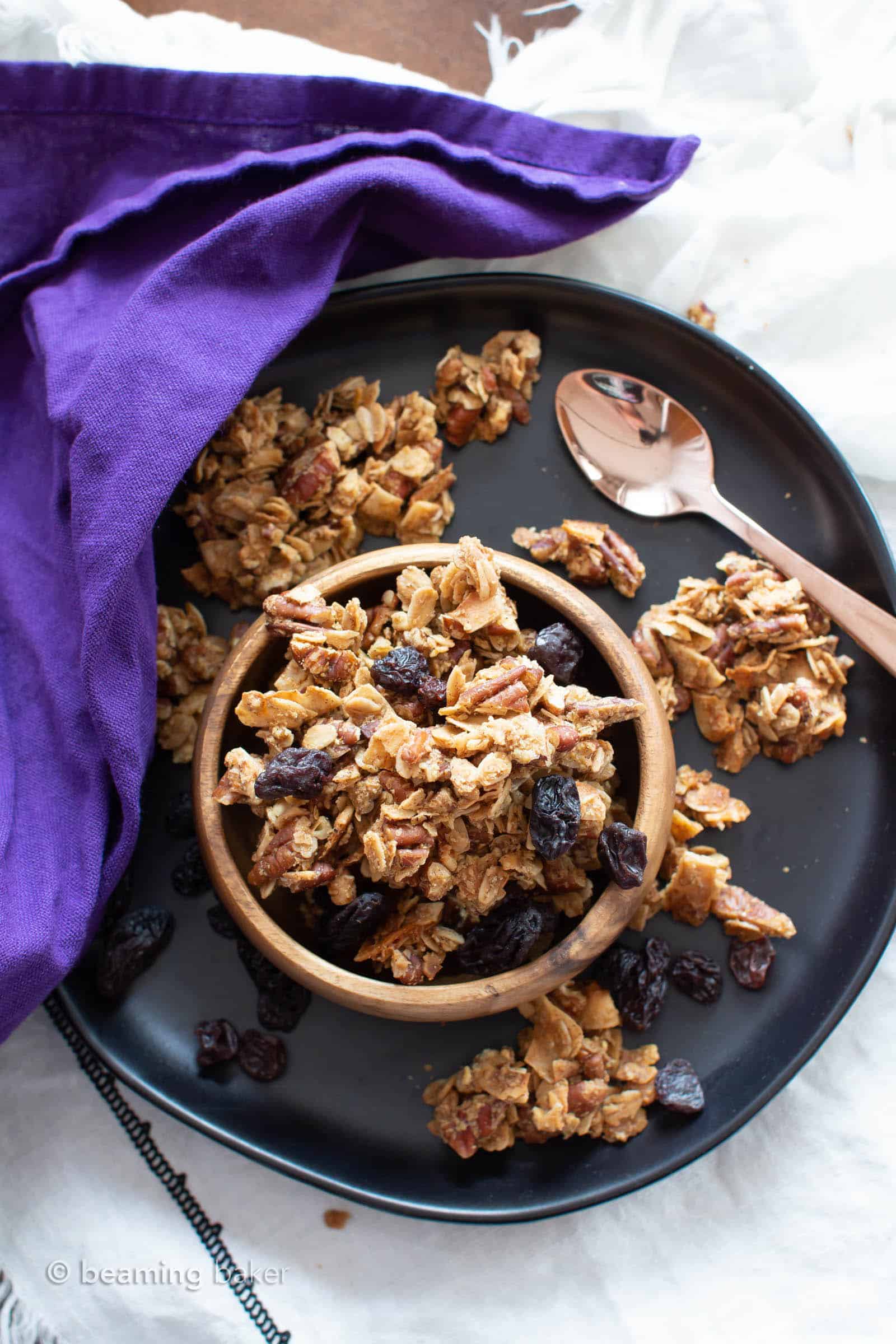 Oatmeal Raisin Vegan Granola Recipe: super CHUNKY, big cluster homemade vegan granola with juicy raisins and fiber-rich oats! Gluten Free, Healthy, Dairy-Free. #Granola #Healthy #GlutenFree #Vegan | Recipe at BeamingBaker.com