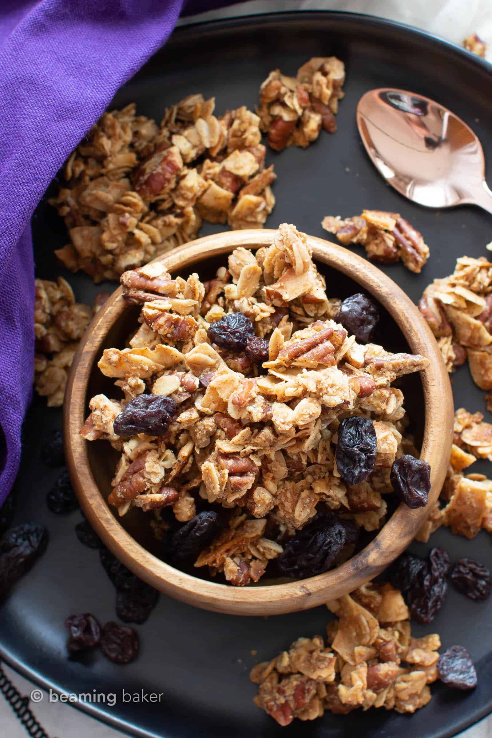 Oatmeal Raisin Vegan Granola Recipe: super CHUNKY, big cluster homemade vegan granola with juicy raisins and fiber-rich oats! Gluten Free, Healthy, Dairy-Free. #Granola #Healthy #GlutenFree #Vegan | Recipe at BeamingBaker.com