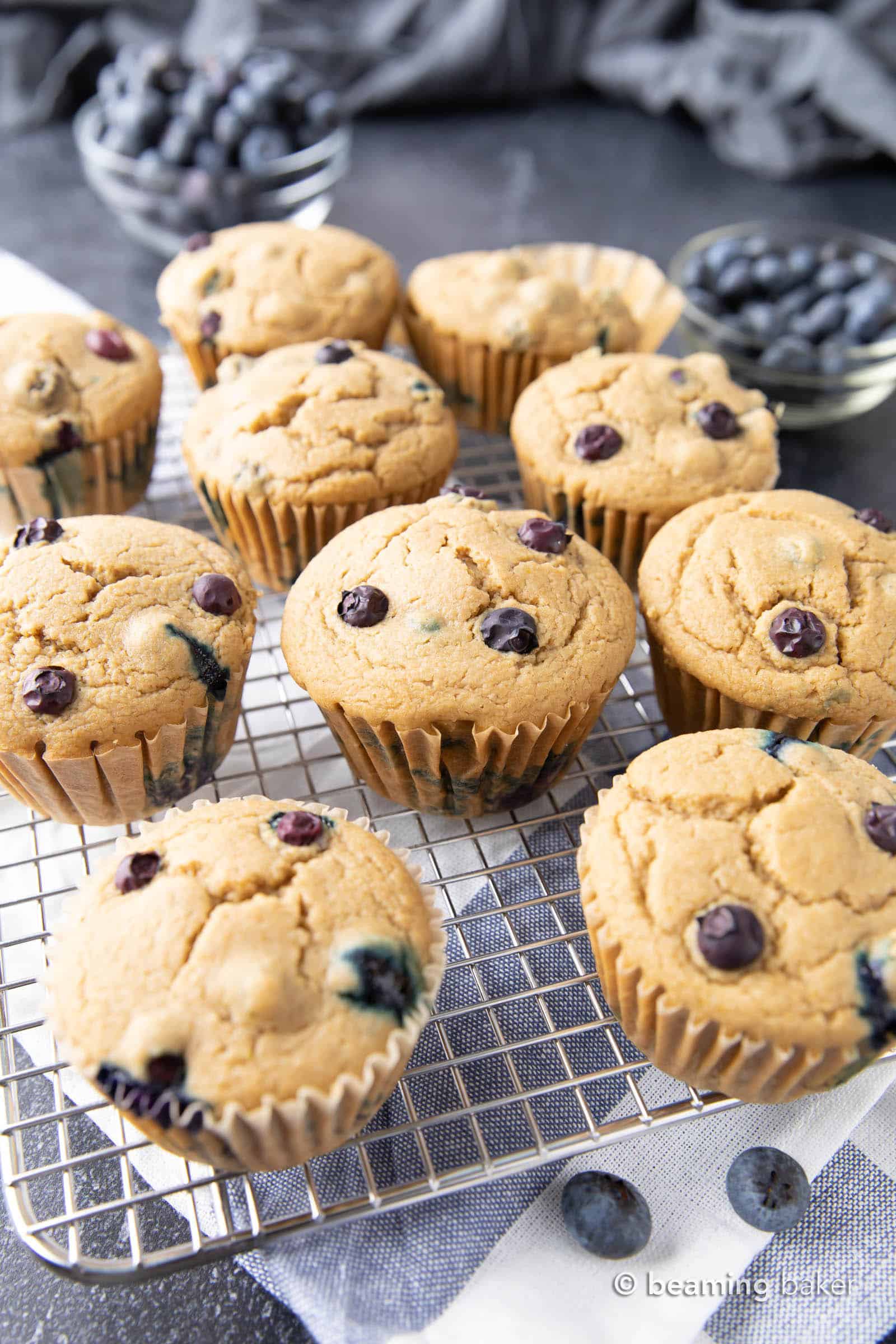 Easy Vegan Blueberry Muffins Recipe: this soft ‘n moist vegan blueberry muffins recipe yields fluffy, bright blueberry muffins. Gluten Free, Dairy-Free. #Vegan #Blueberry #Muffins #GlutenFree | Recipe at BeamingBaker.com