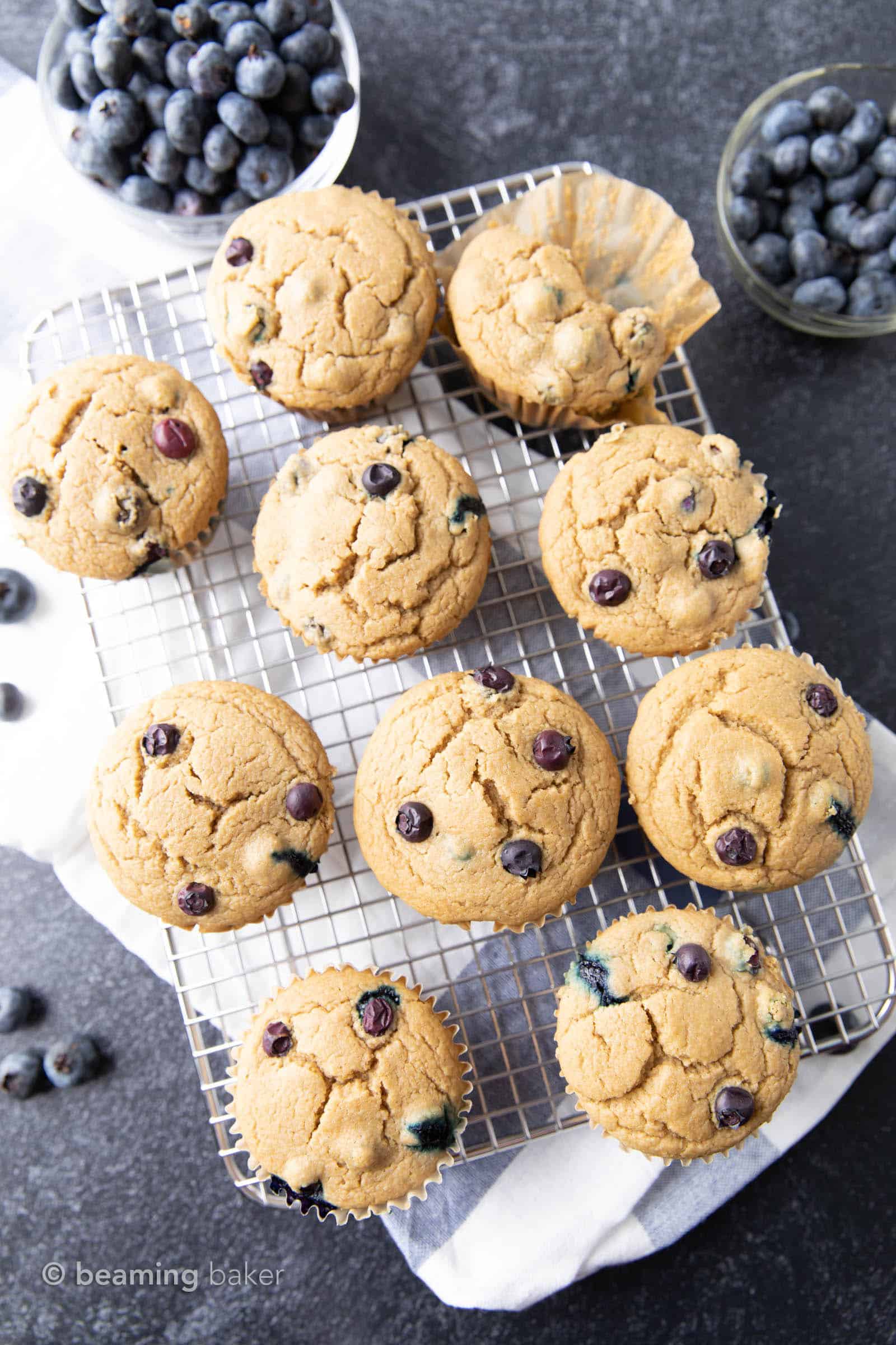 Easy Vegan Blueberry Muffins Recipe: this soft ‘n moist vegan blueberry muffins recipe yields fluffy, bright blueberry muffins. Gluten Free, Dairy-Free. #Vegan #Blueberry #Muffins #GlutenFree | Recipe at BeamingBaker.com