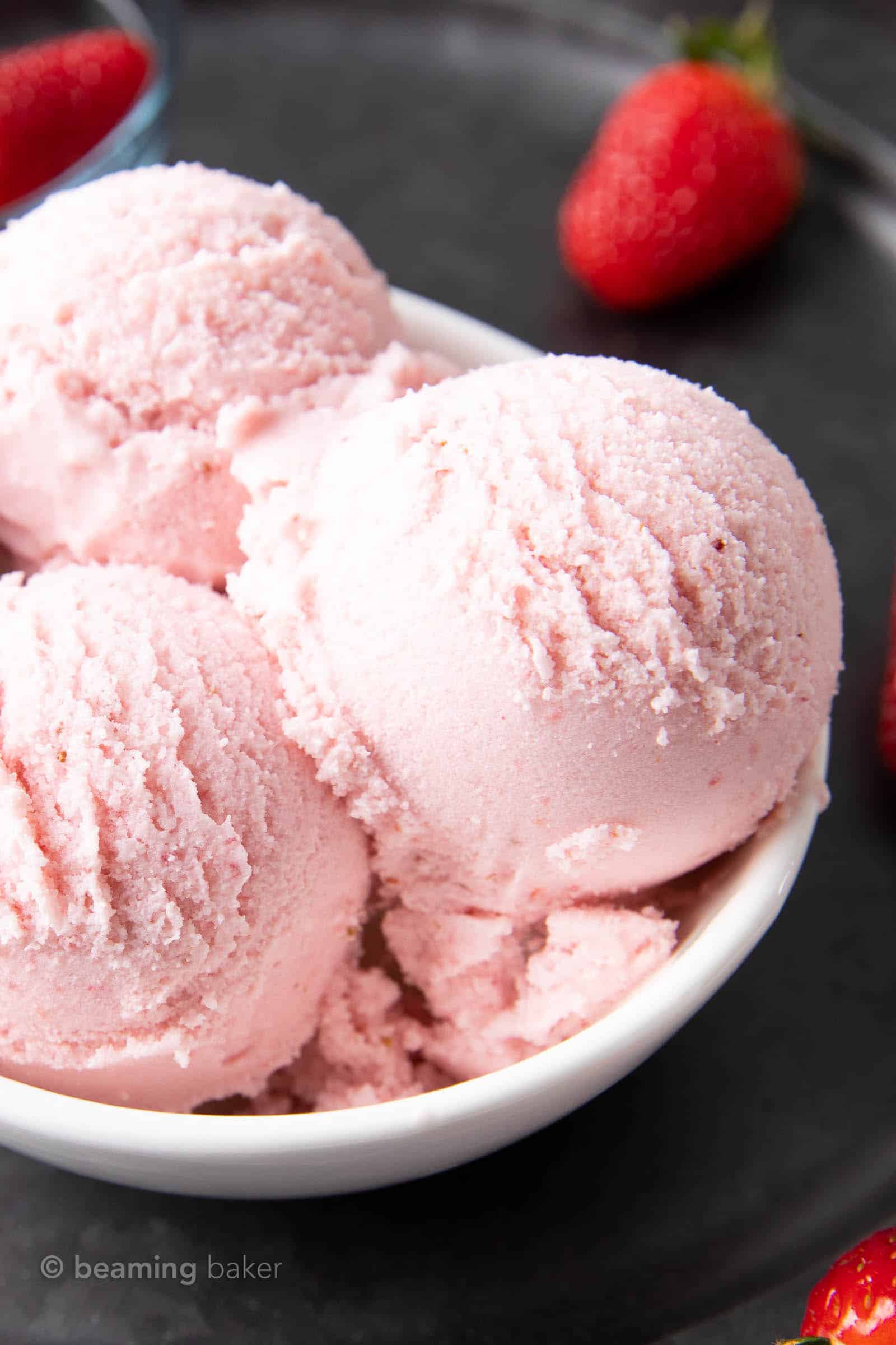 Strawberry Vegan Ice Cream (Dairy-Free): the BEST vegan strawberry ice cream is fresh, sweet & creamy, bursting with strawberry flavor. Homemade vegan ice cream that’s easy! #Vegan #IceCream #DairyFree #Strawberries | Recipe at BeamingBaker.com
