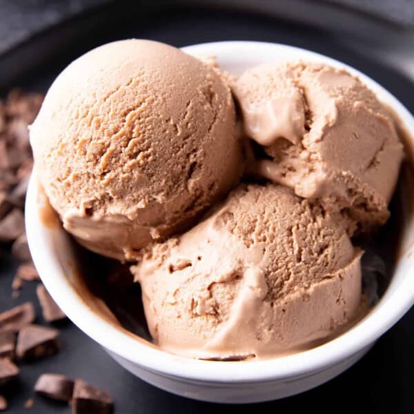 Chocolate Keto Ice Cream Recipe: this decadent chocolate keto ice cream recipe yields rich ‘n creamy homemade keto ice cream. Just 1 net carb for delicious keto ice cream! #Keto #KetoIceCream #LowCarb #Chocolate | Recipe at BeamingBaker.com