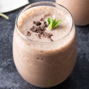 Protein shake recipe in a glass topped with a garnish