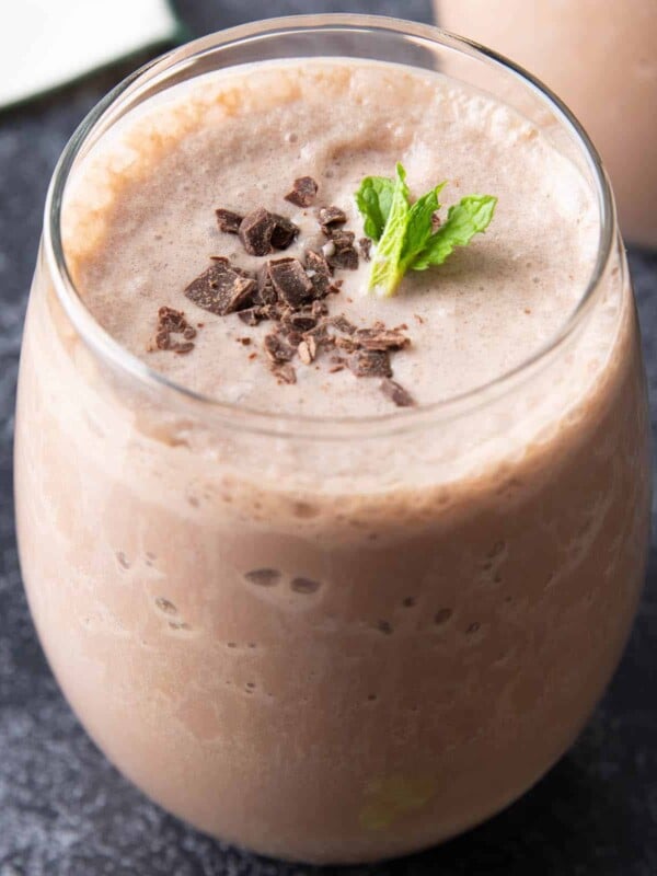 Protein shake recipe in a glass topped with a garnish