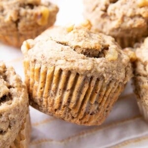 Vegan Banana Muffins Recipe: soft ‘n moist vegan banana bread muffins with a satisfying texture and big banana flavor! #Vegan #Banana #Muffins #DairyFree | Recipe at BeamingBaker.com