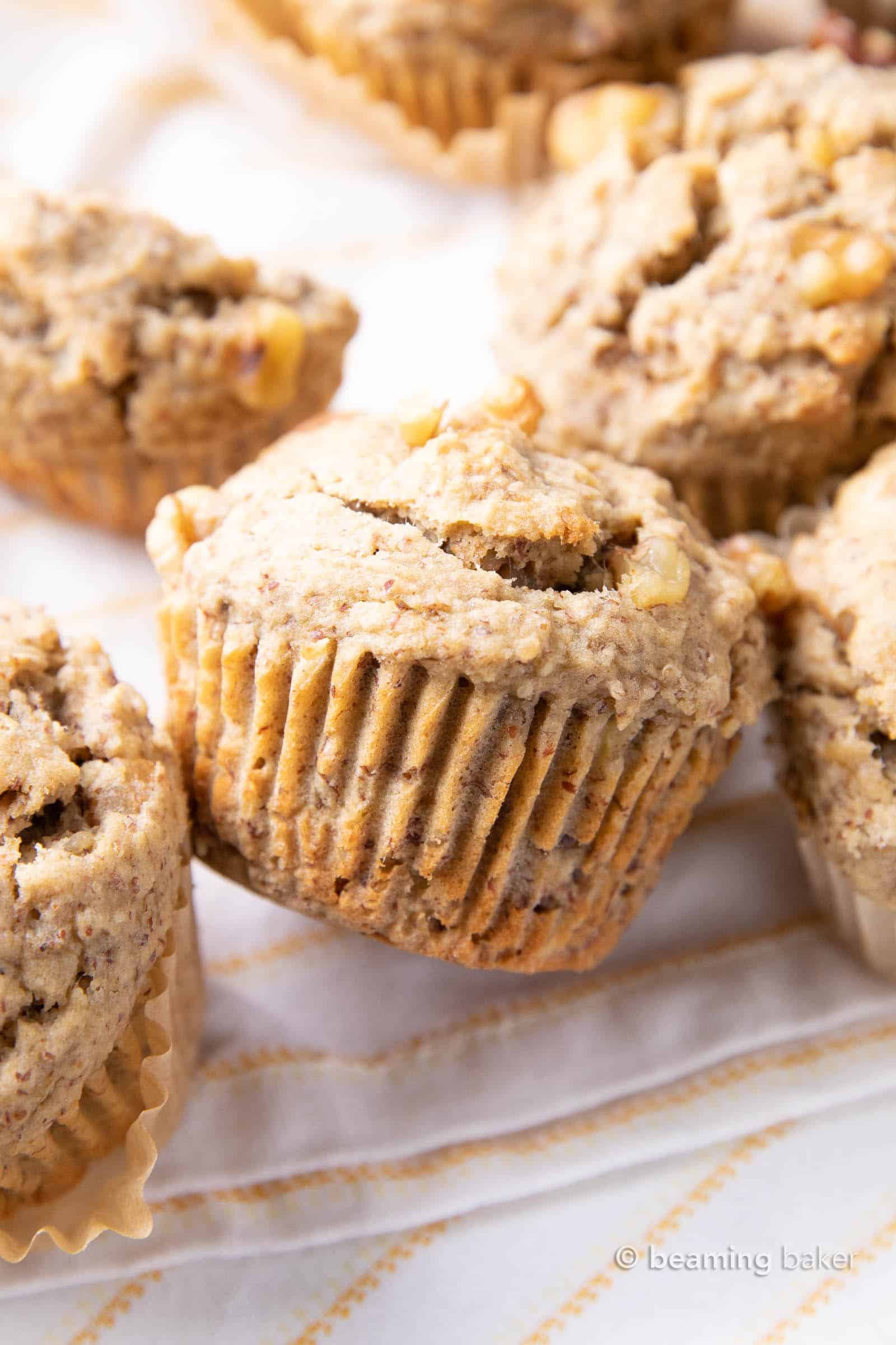 Vegan Banana Muffins Recipe: soft ‘n moist vegan banana bread muffins with a satisfying texture and big banana flavor! #Vegan #Banana #Muffins #DairyFree | Recipe at BeamingBaker.com